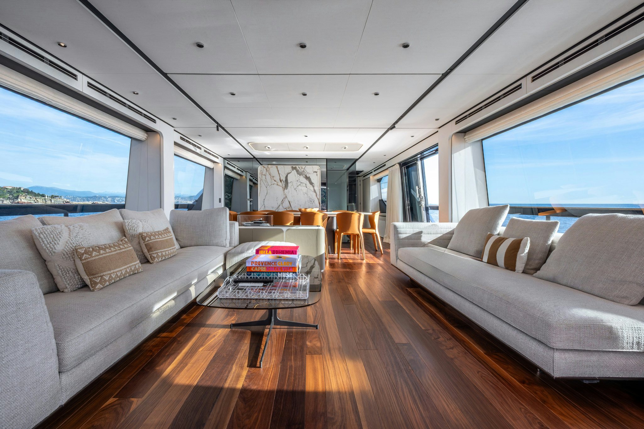 a living room with a couch and a table aboard TOGETHER Yacht for Charter