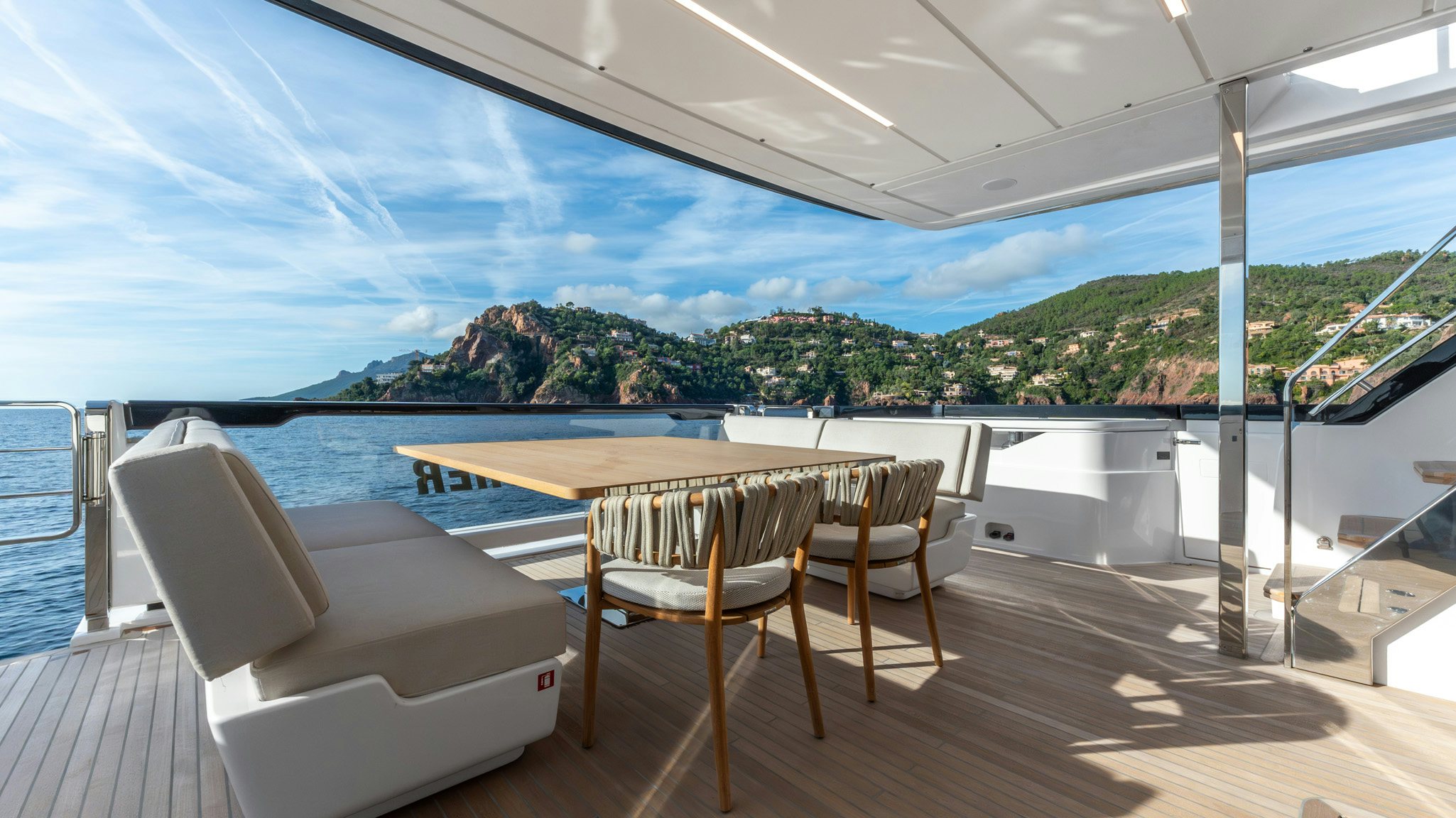 a table and chairs on a deck aboard TOGETHER Yacht for Charter