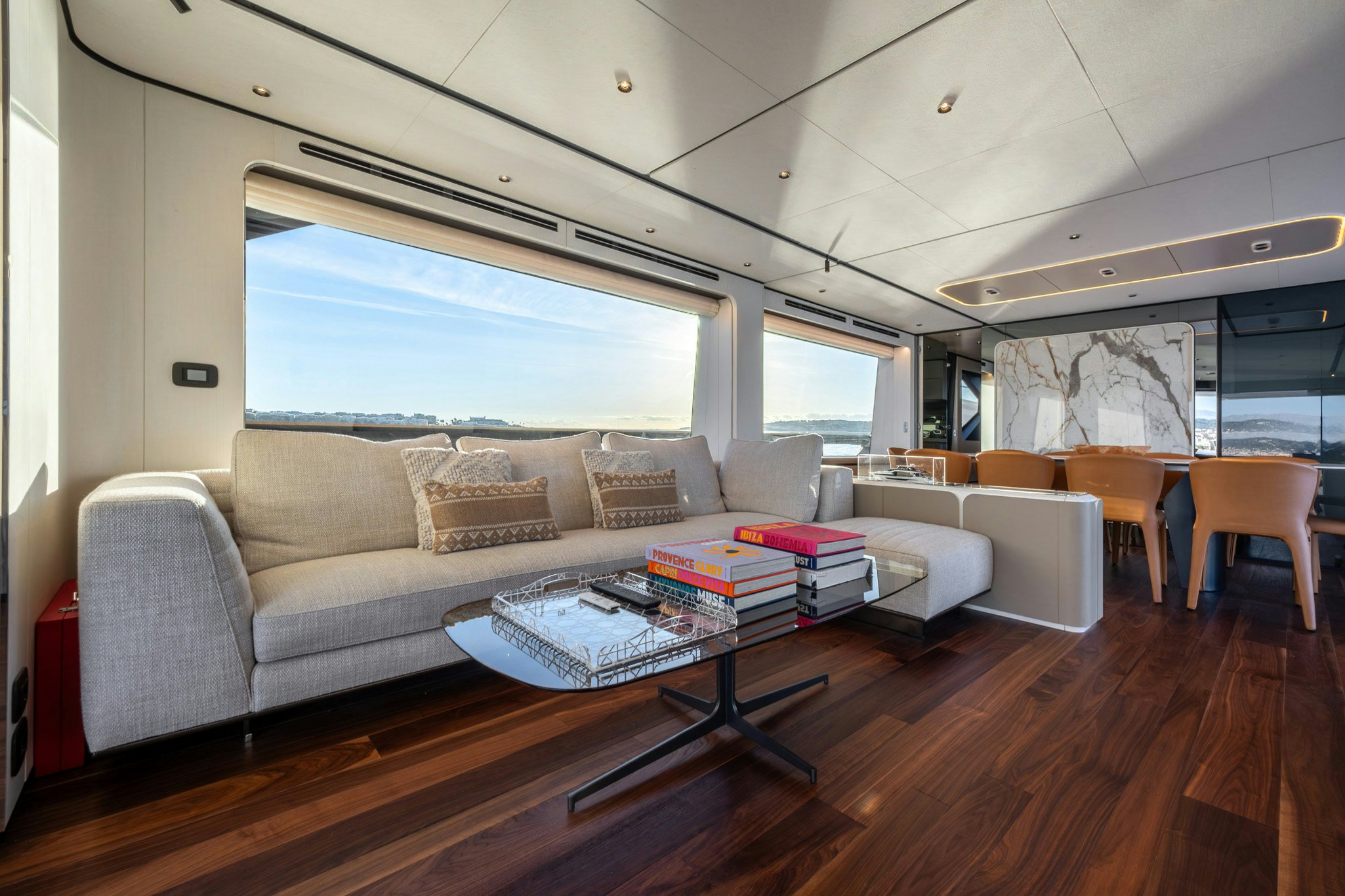a living room with a couch and a table aboard TOGETHER Yacht for Charter