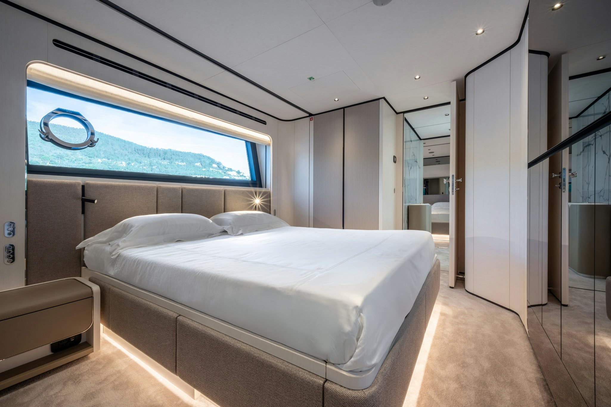 a room with a bed and a window aboard TOGETHER Yacht for Charter