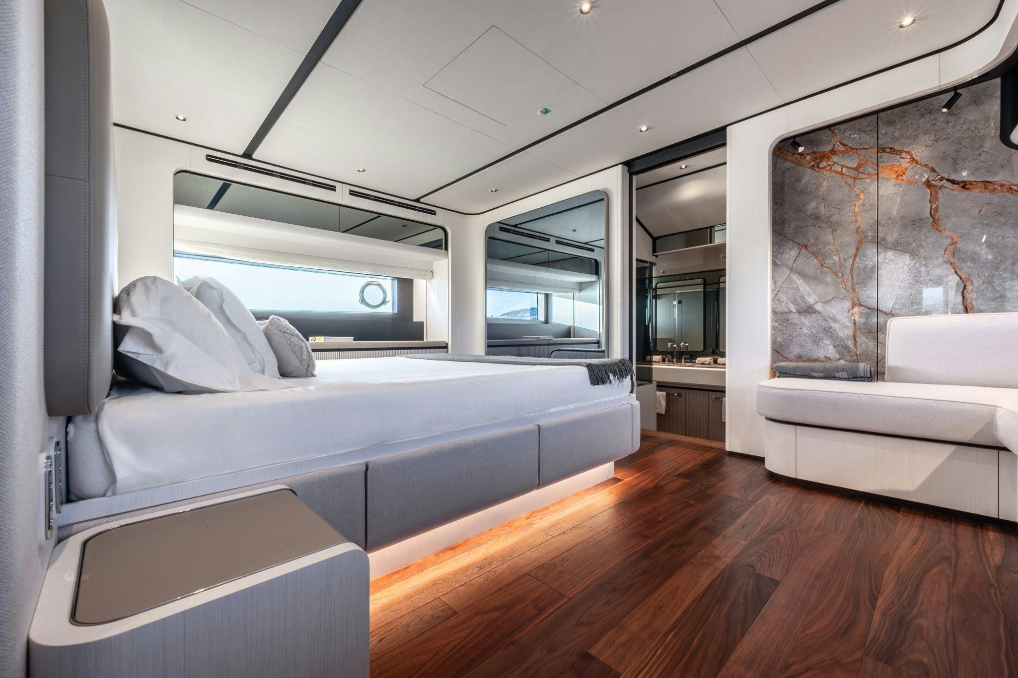 a room with a bed and a couch aboard TOGETHER Yacht for Charter