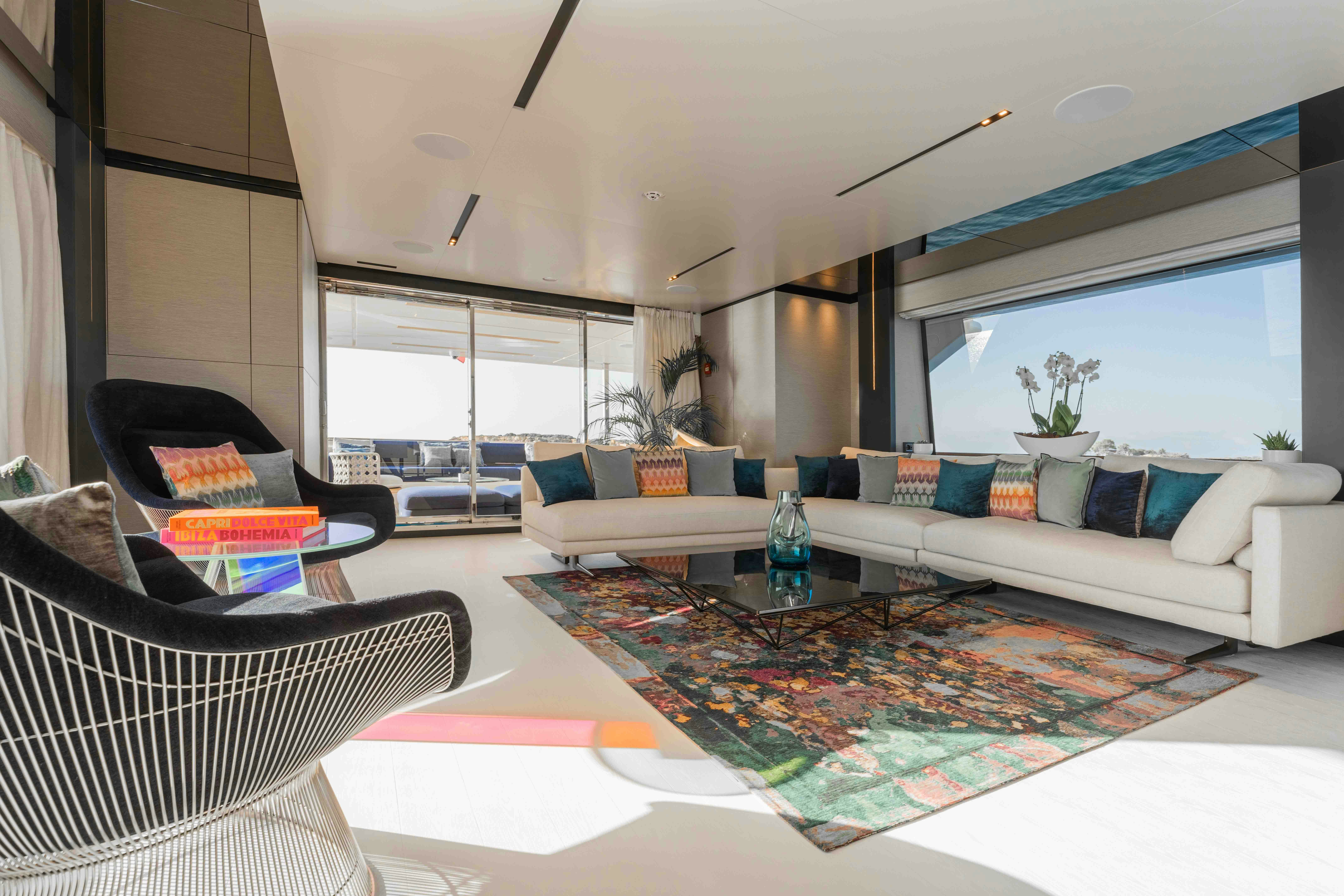 a living room with a large rug aboard RENEWAL 3 Yacht for Sale