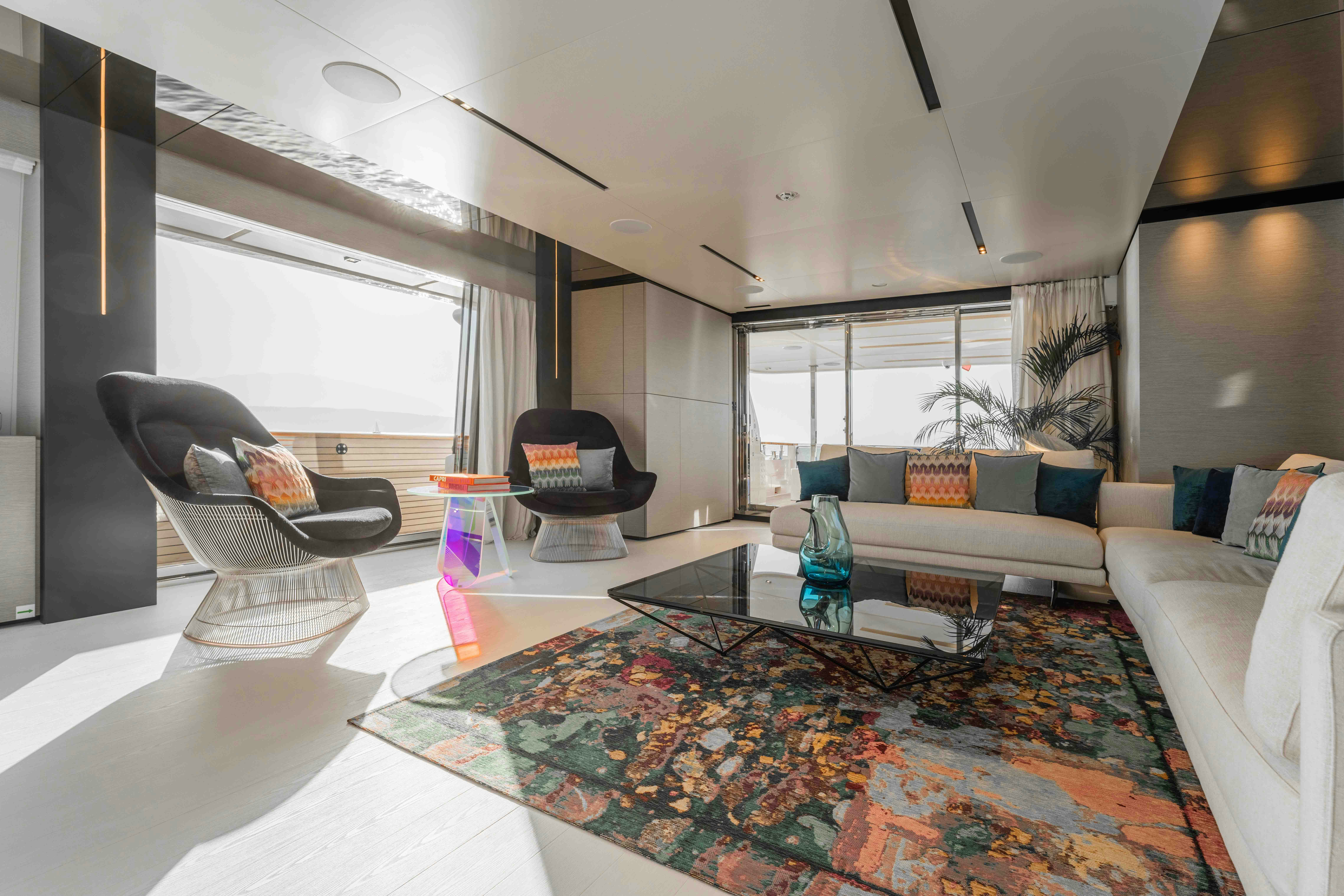 a living room with a couch and a coffee table aboard RENEWAL 3 Yacht for Sale