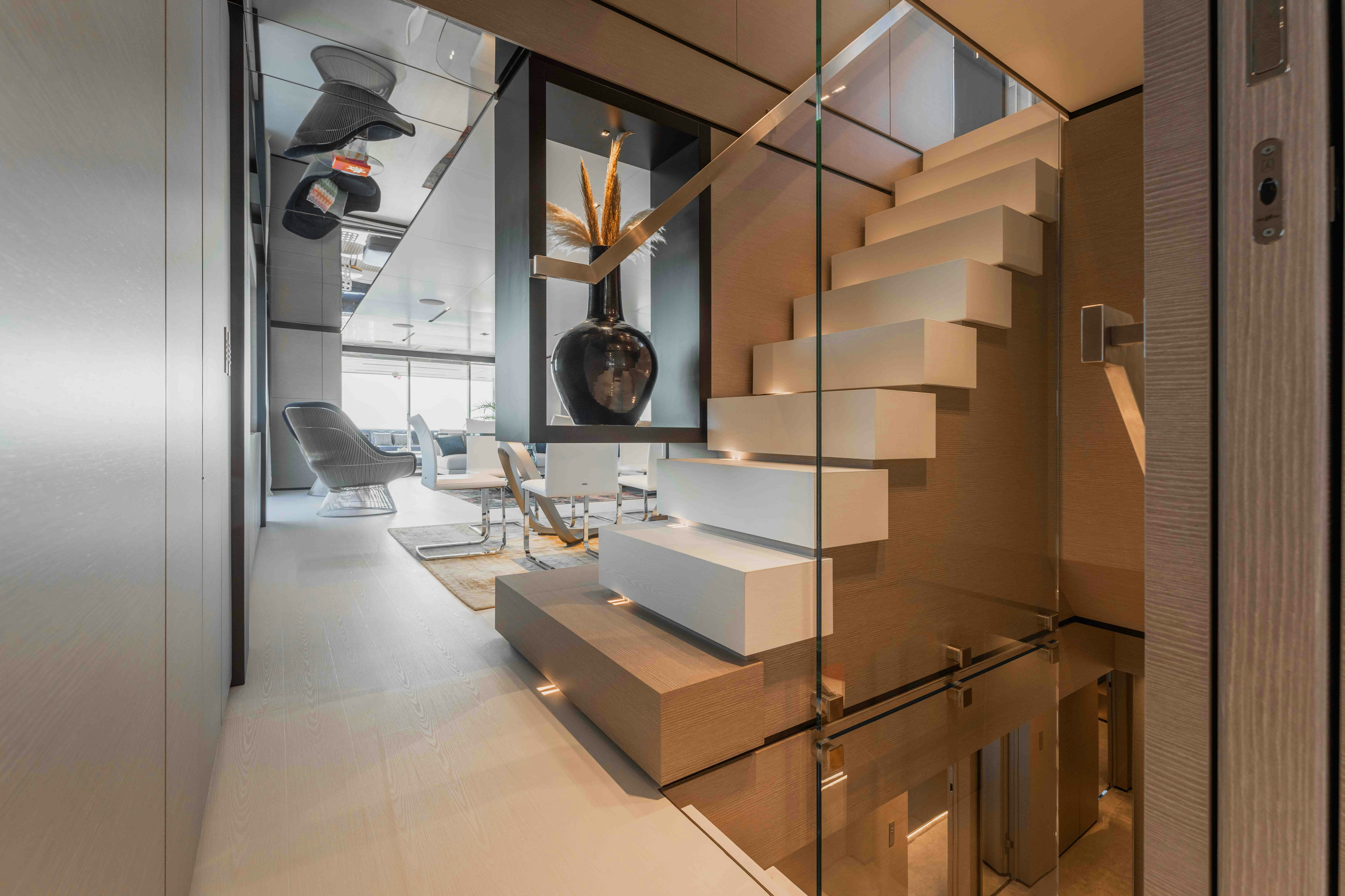 a room with shelves and a chair aboard RENEWAL 3 Yacht for Sale