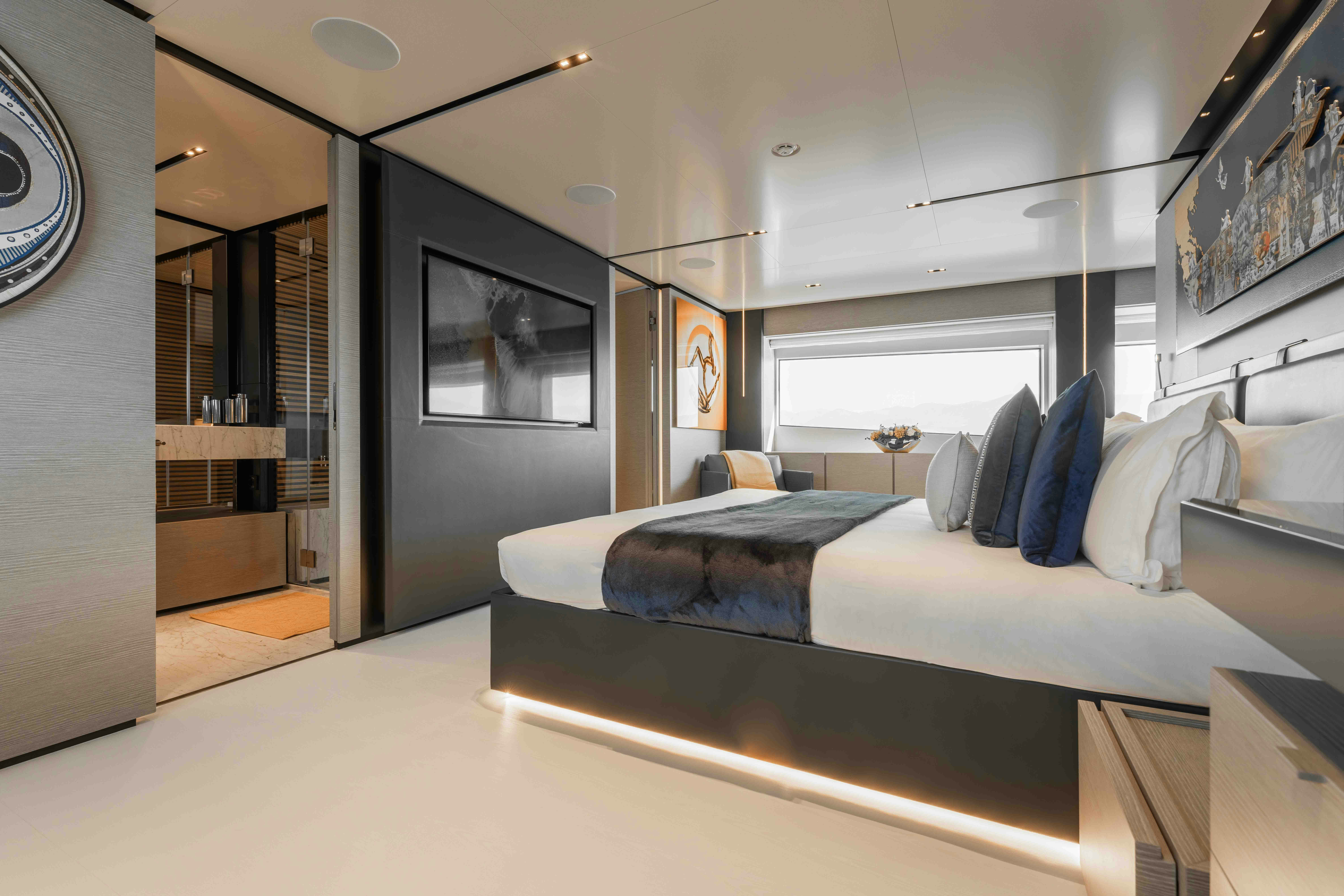 a modern bedroom with a large bed aboard RENEWAL 3 Yacht for Sale