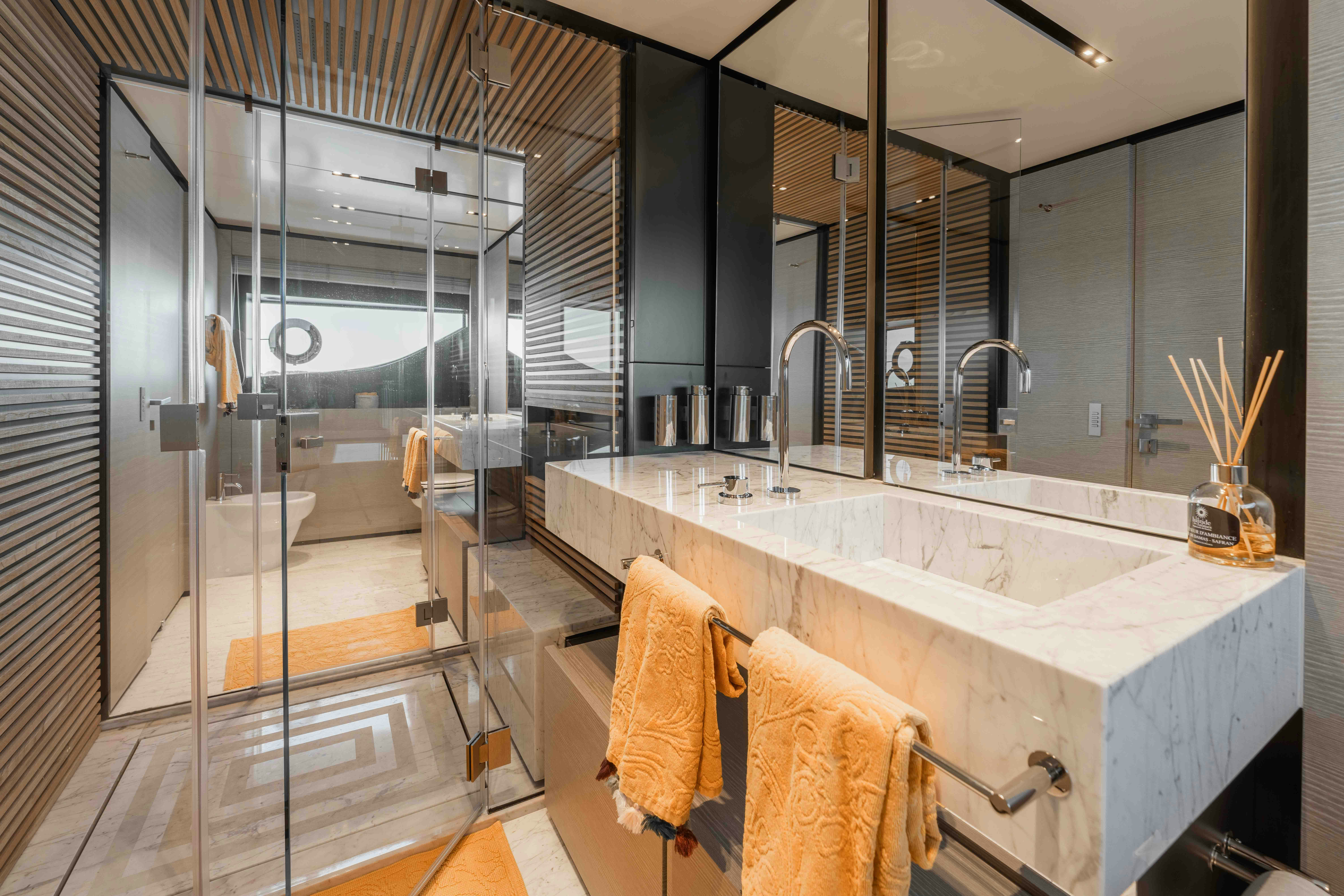 a bathroom with a glass shower aboard RENEWAL 3 Yacht for Sale
