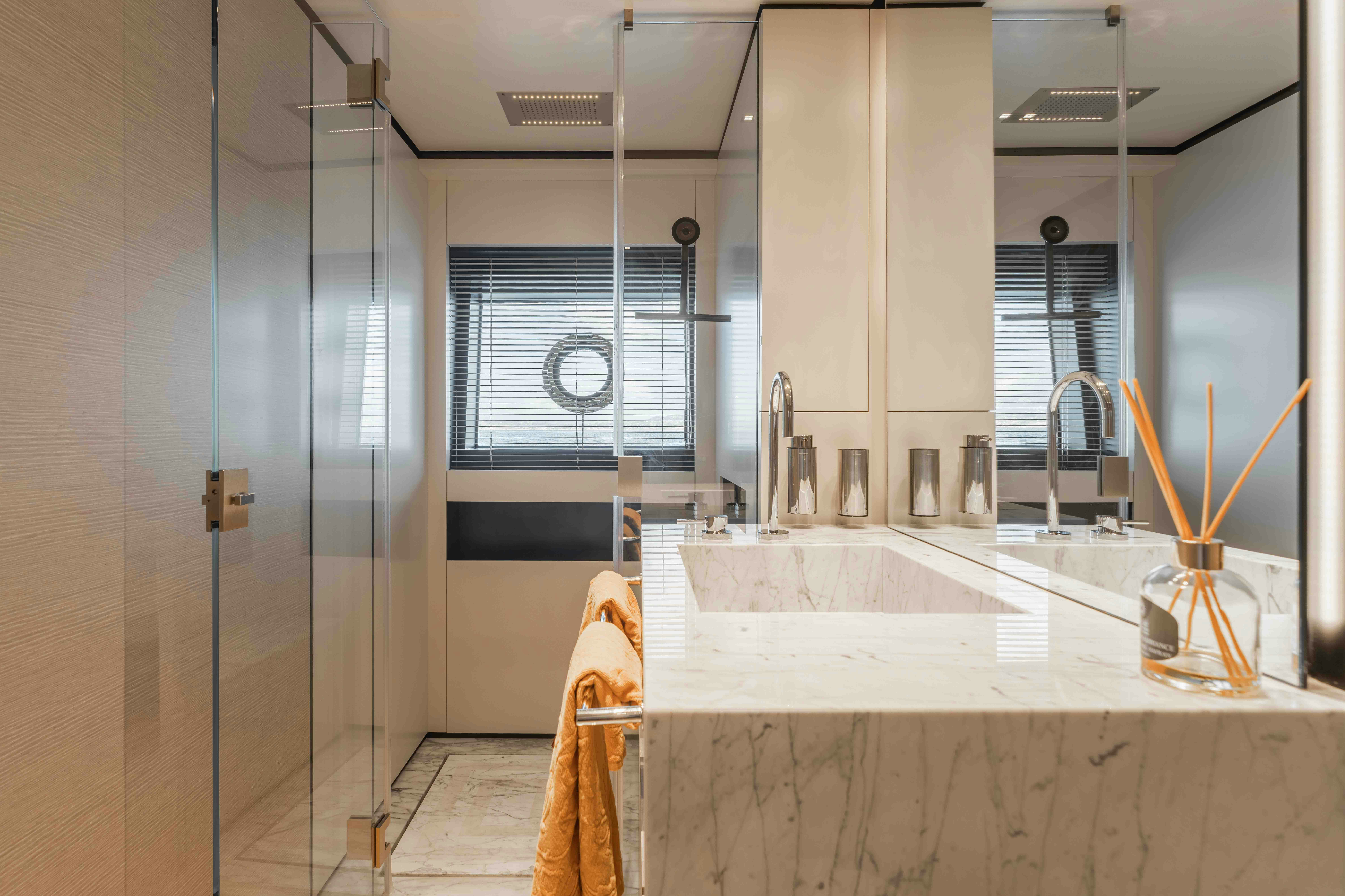a bathroom with a shower and sink aboard RENEWAL 3 Yacht for Sale