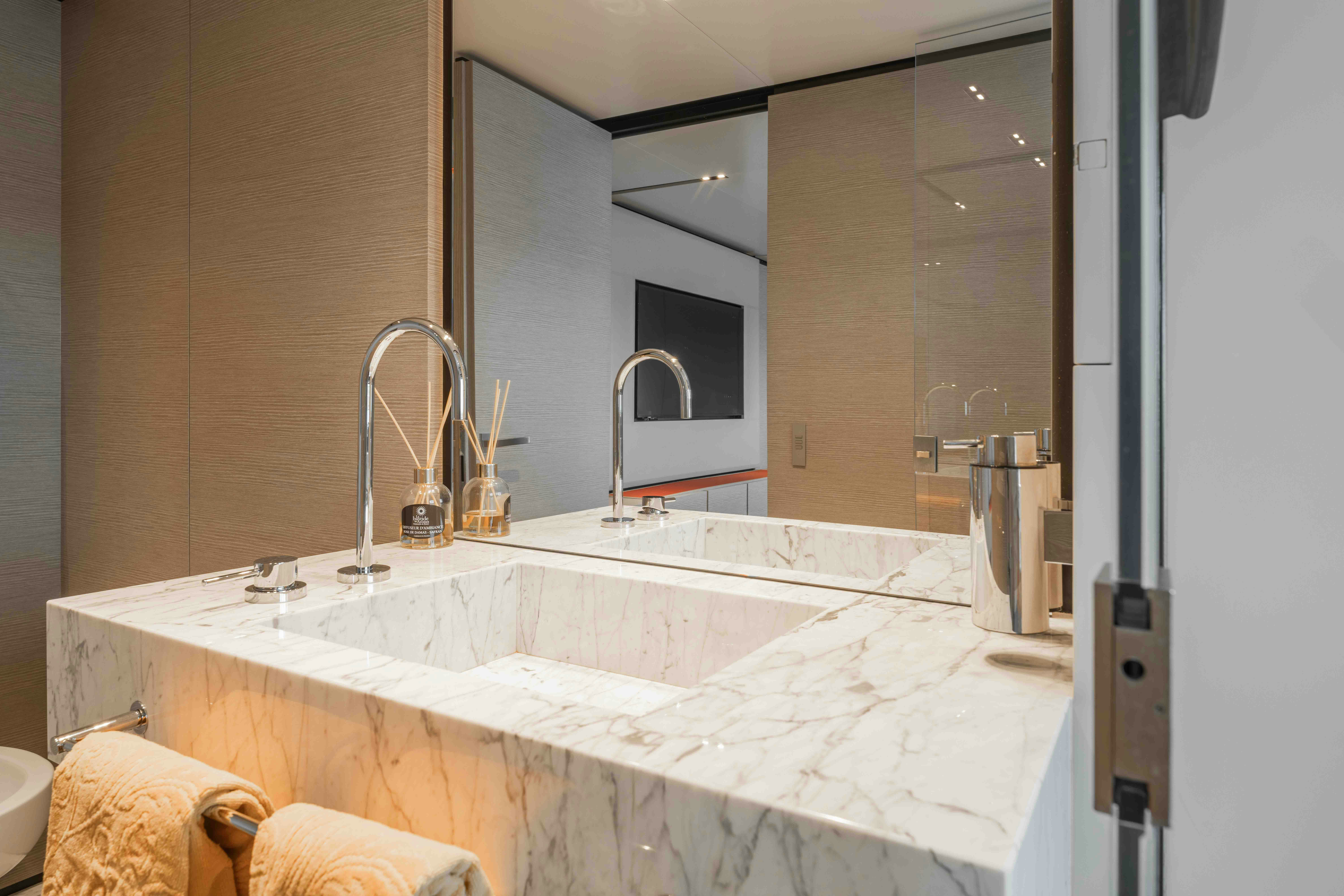 a bathroom with a large mirror aboard RENEWAL 3 Yacht for Sale