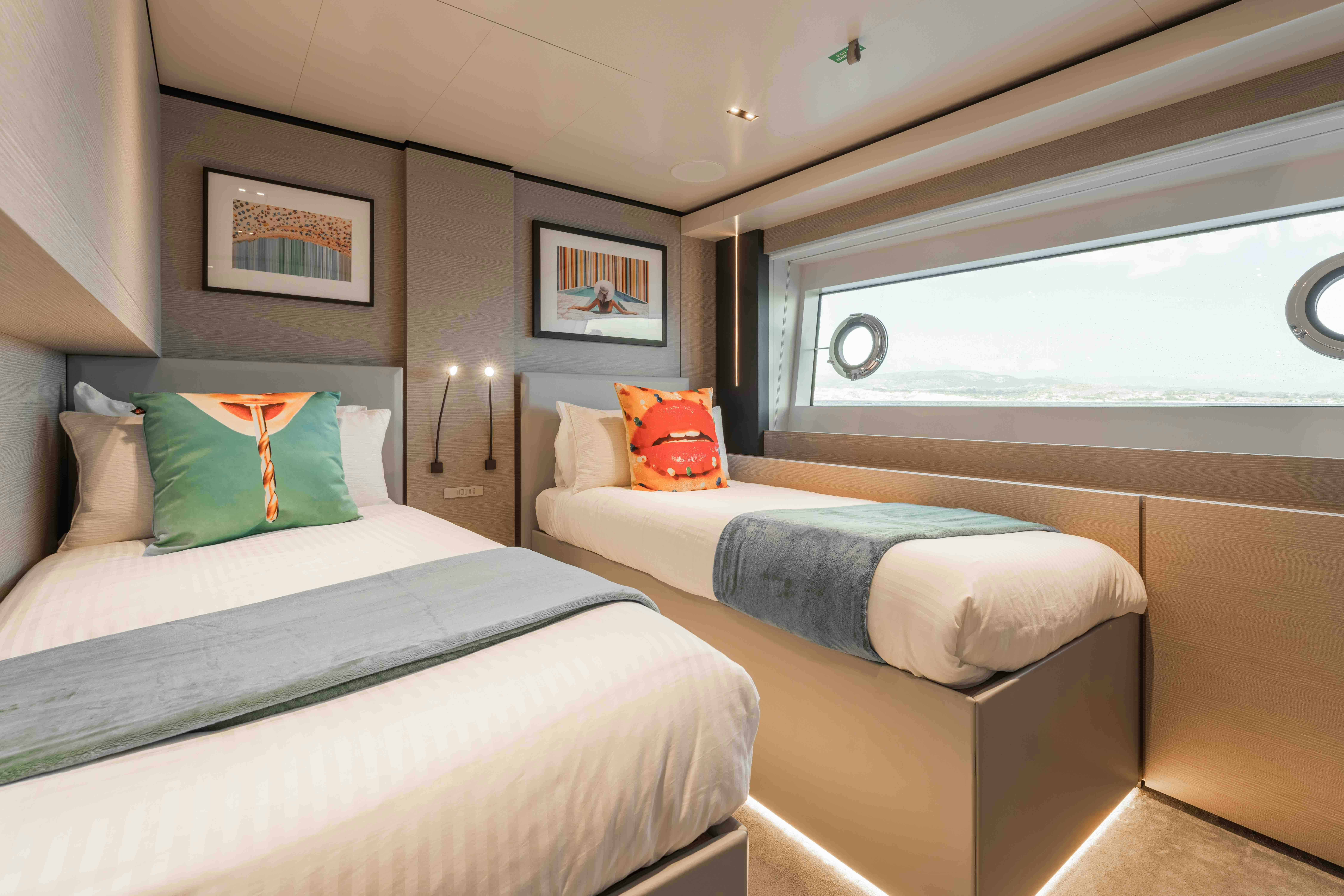 a couple of beds in a room aboard RENEWAL 3 Yacht for Sale