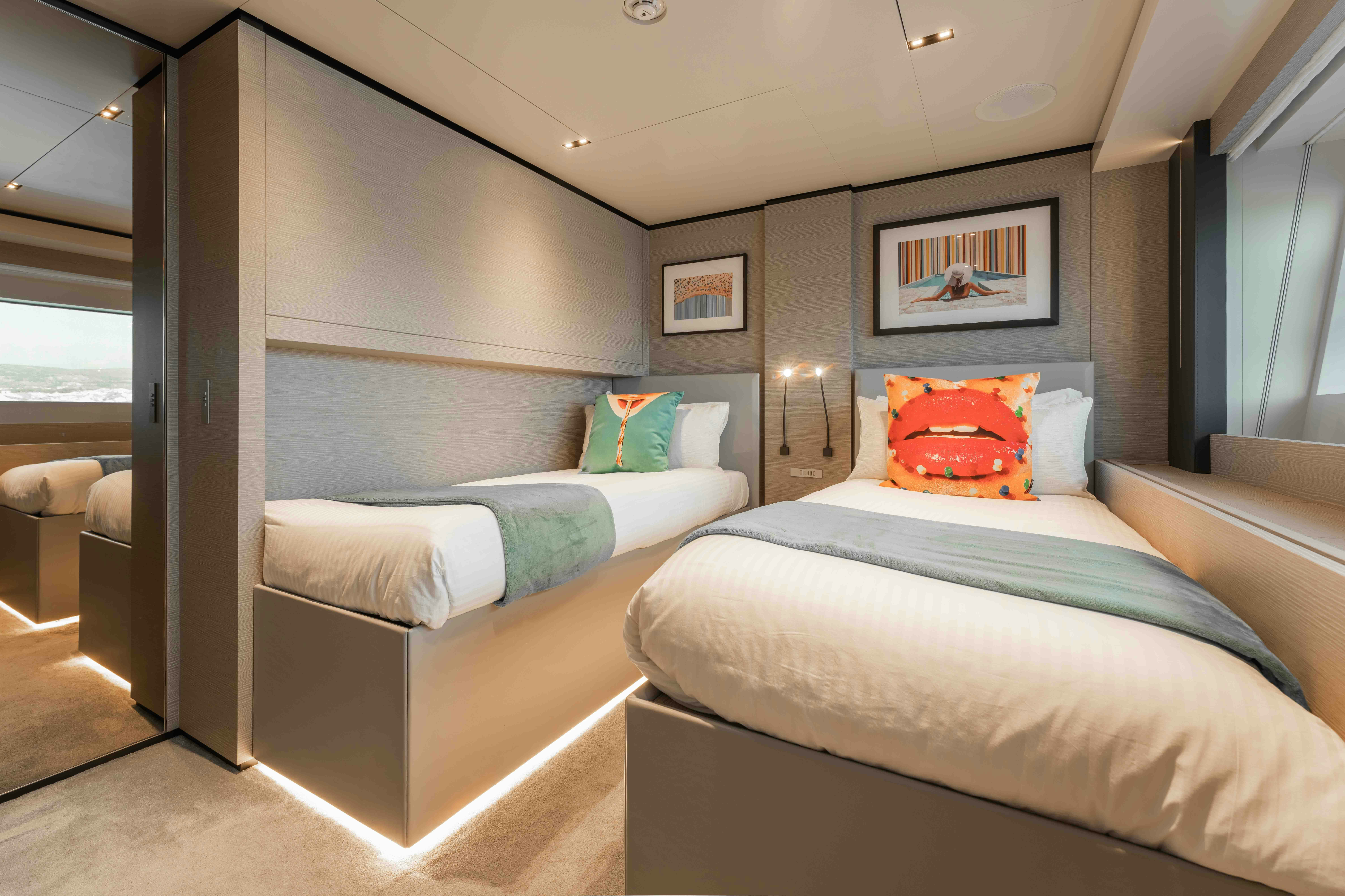a room with two beds aboard RENEWAL 3 Yacht for Sale