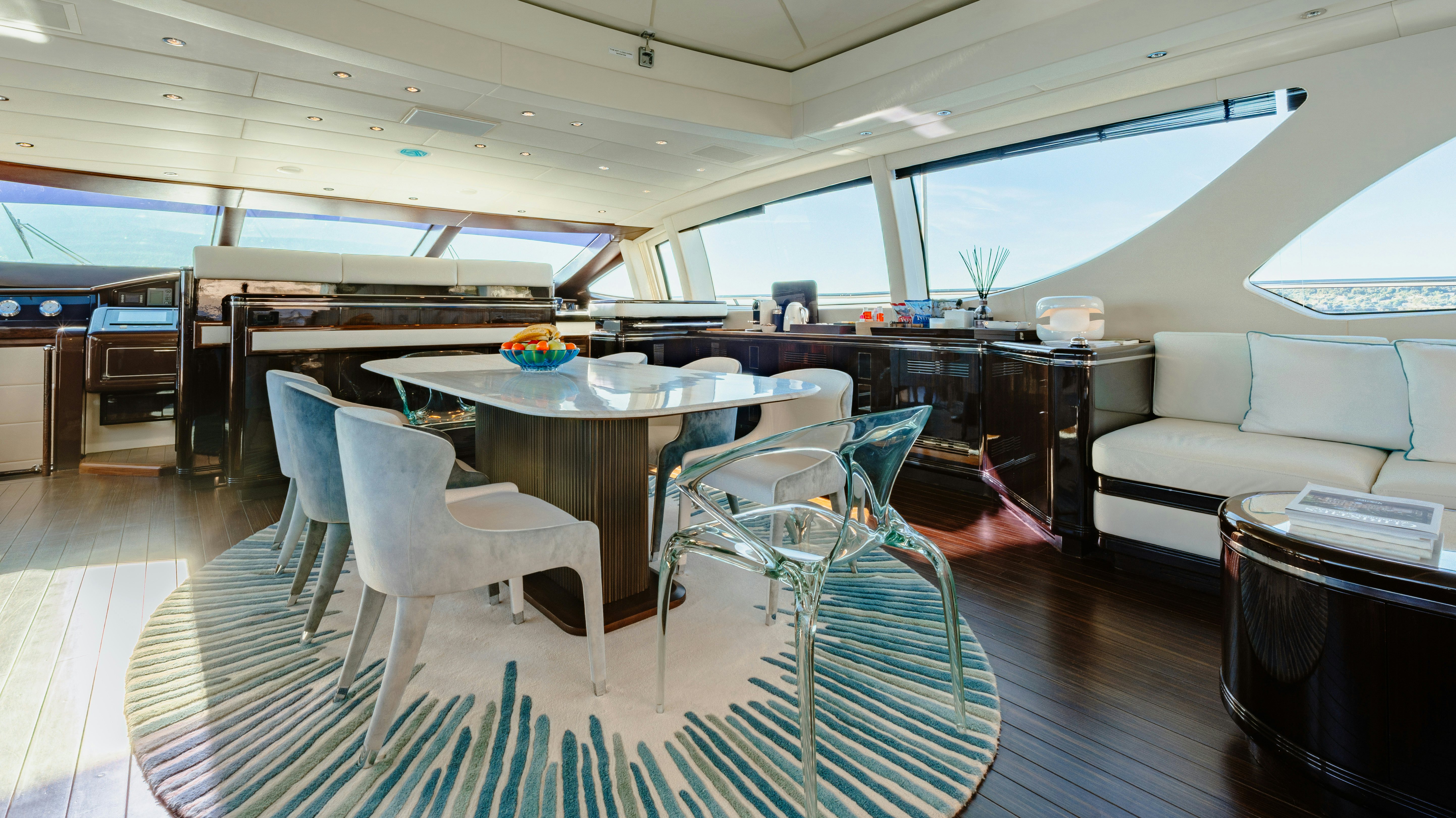a room with a table and chairs aboard BLUE AZUR Yacht for Sale