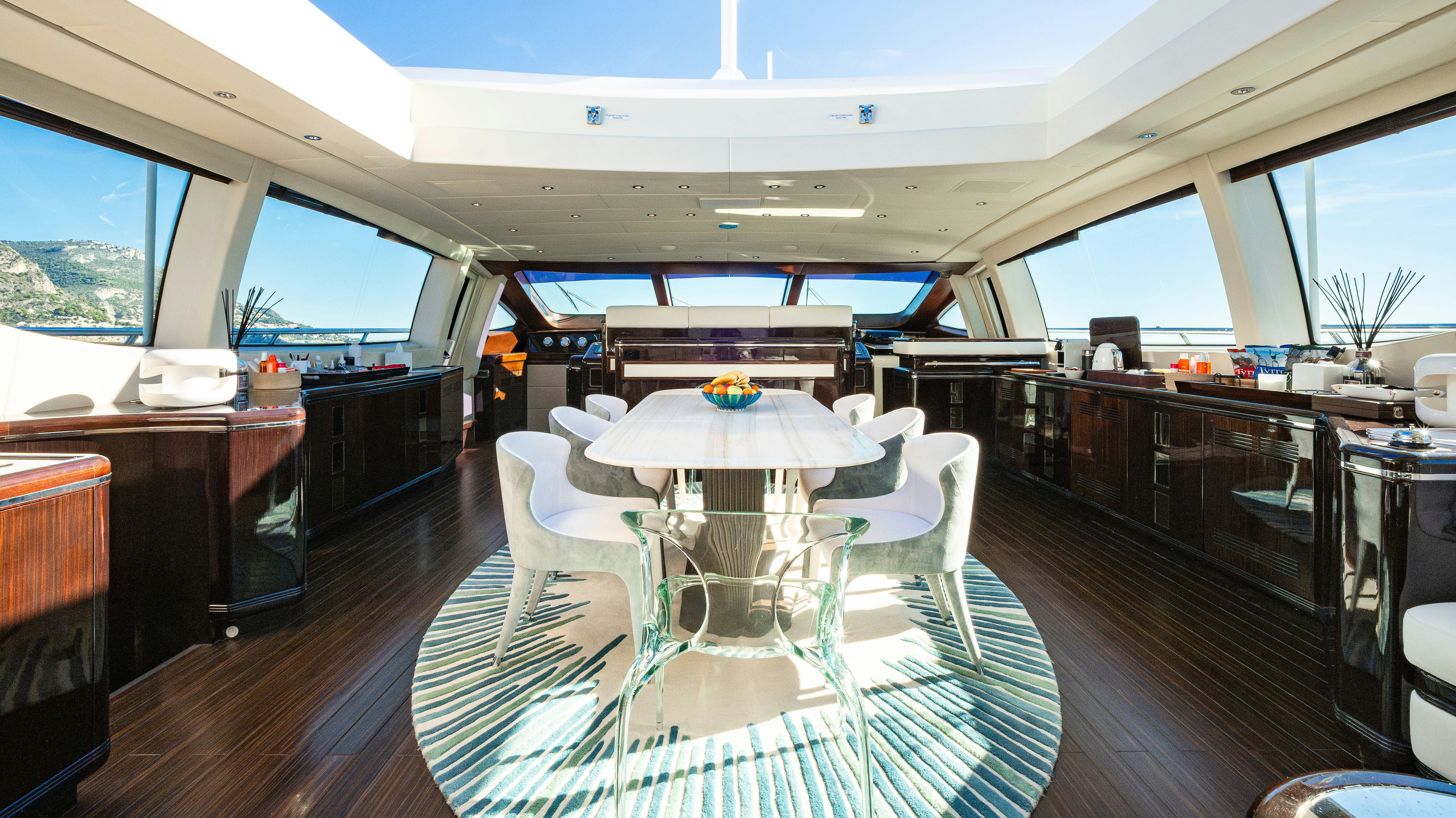 a room with a table and chairs aboard BLUE AZUR Yacht for Sale