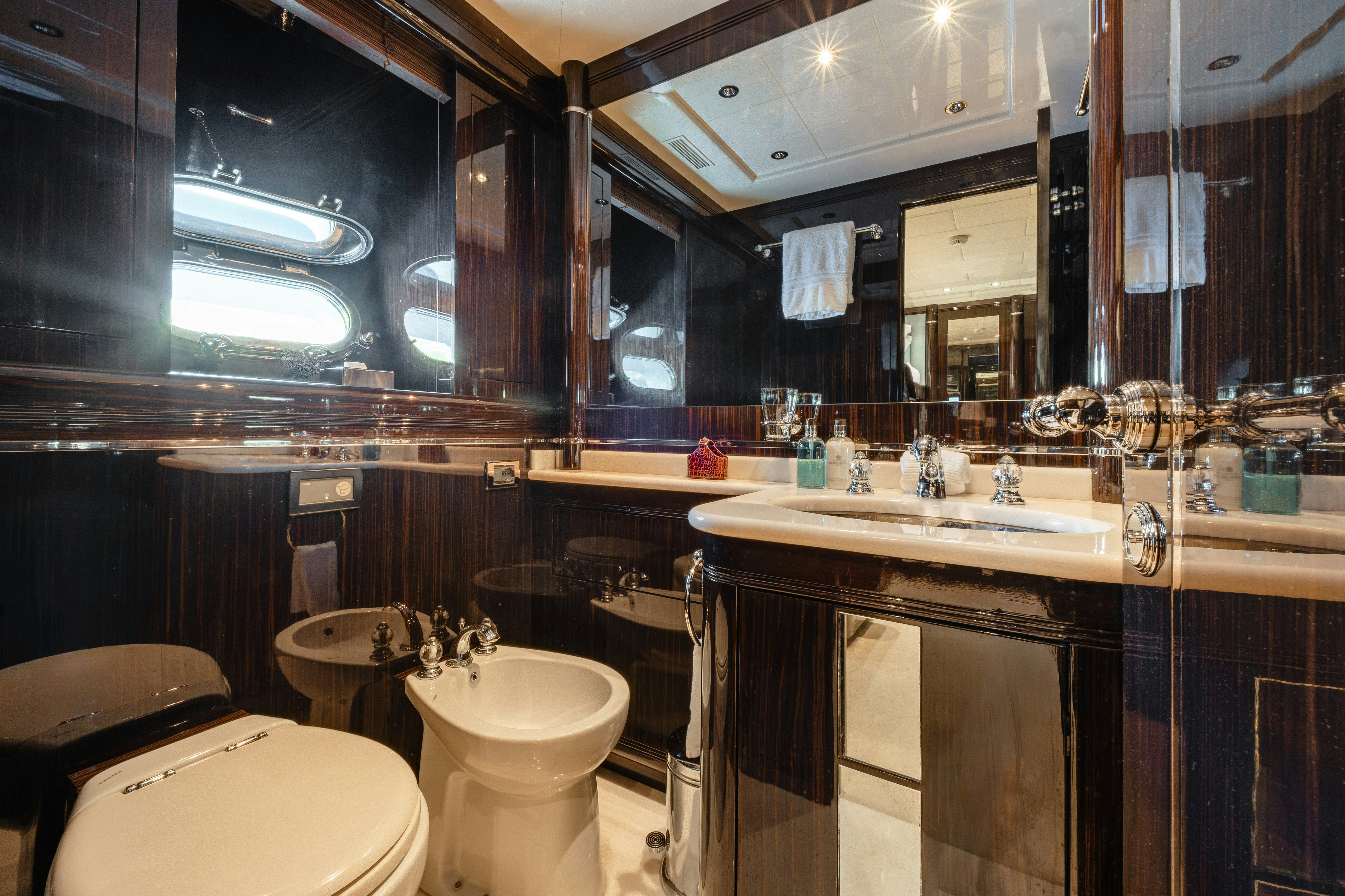 a bathroom with a large mirror aboard BLUE AZUR Yacht for Sale