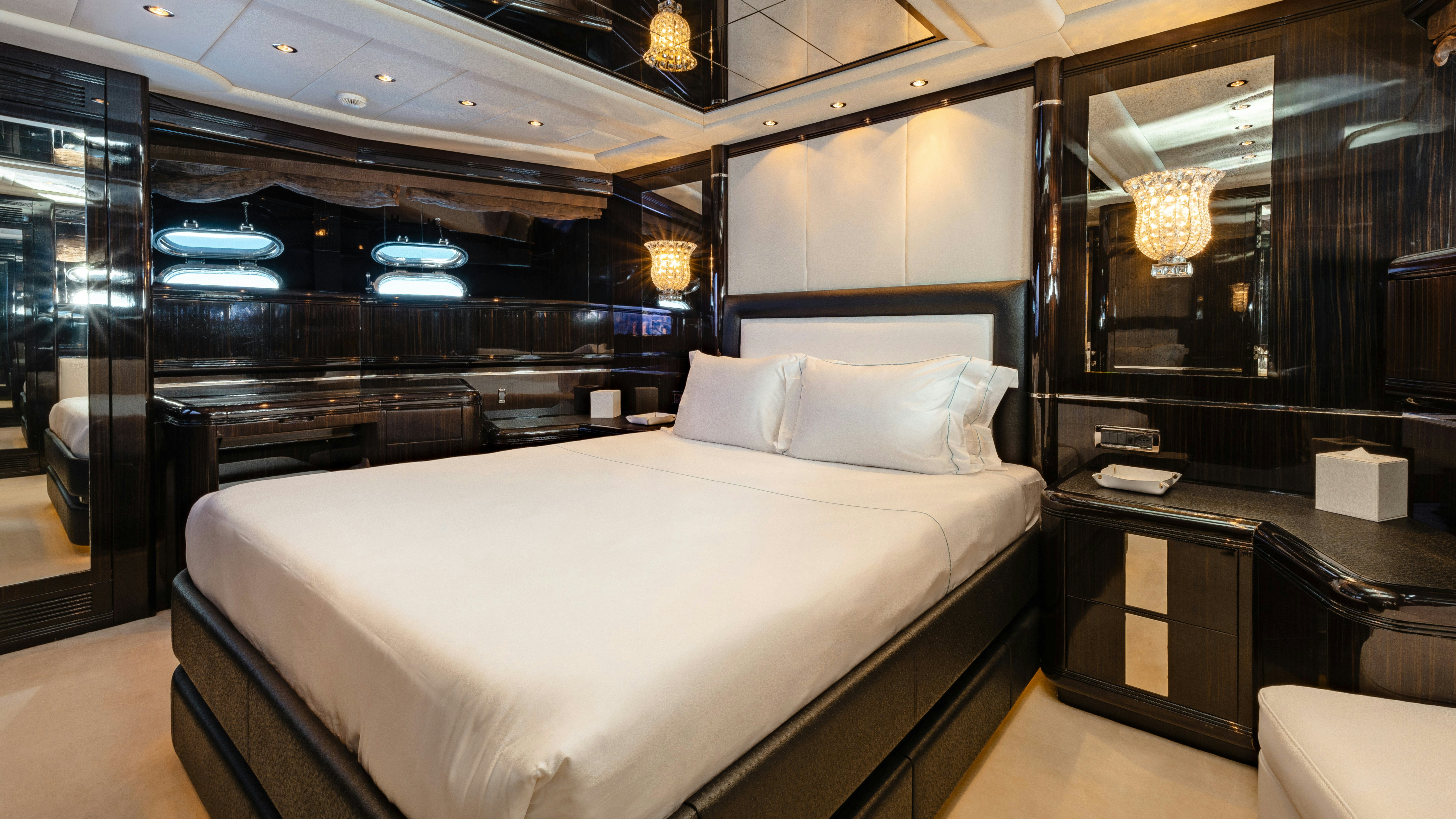 a room with a bed and a desk aboard BLUE AZUR Yacht for Sale