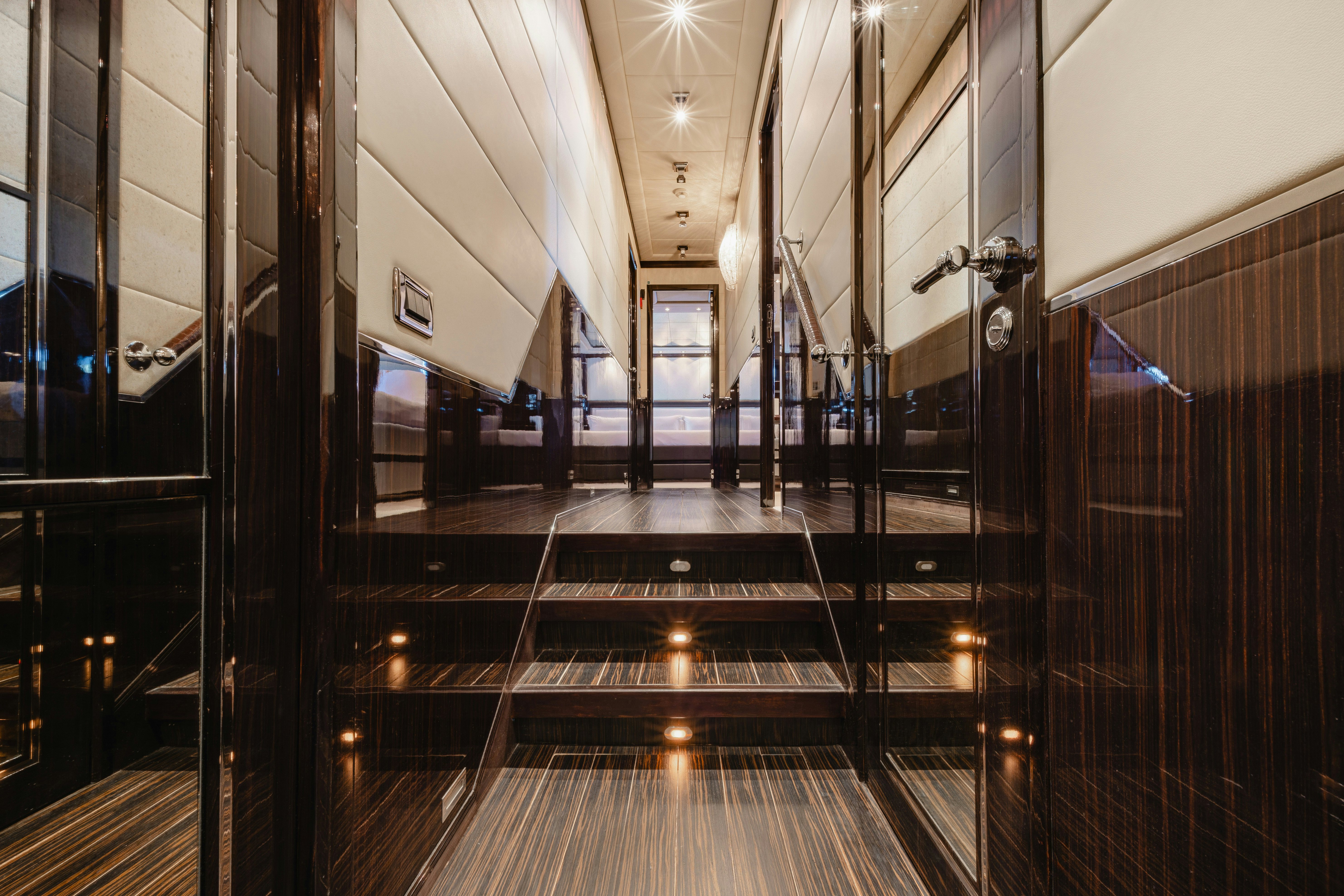 a hallway with metal railings aboard BLUE AZUR Yacht for Sale