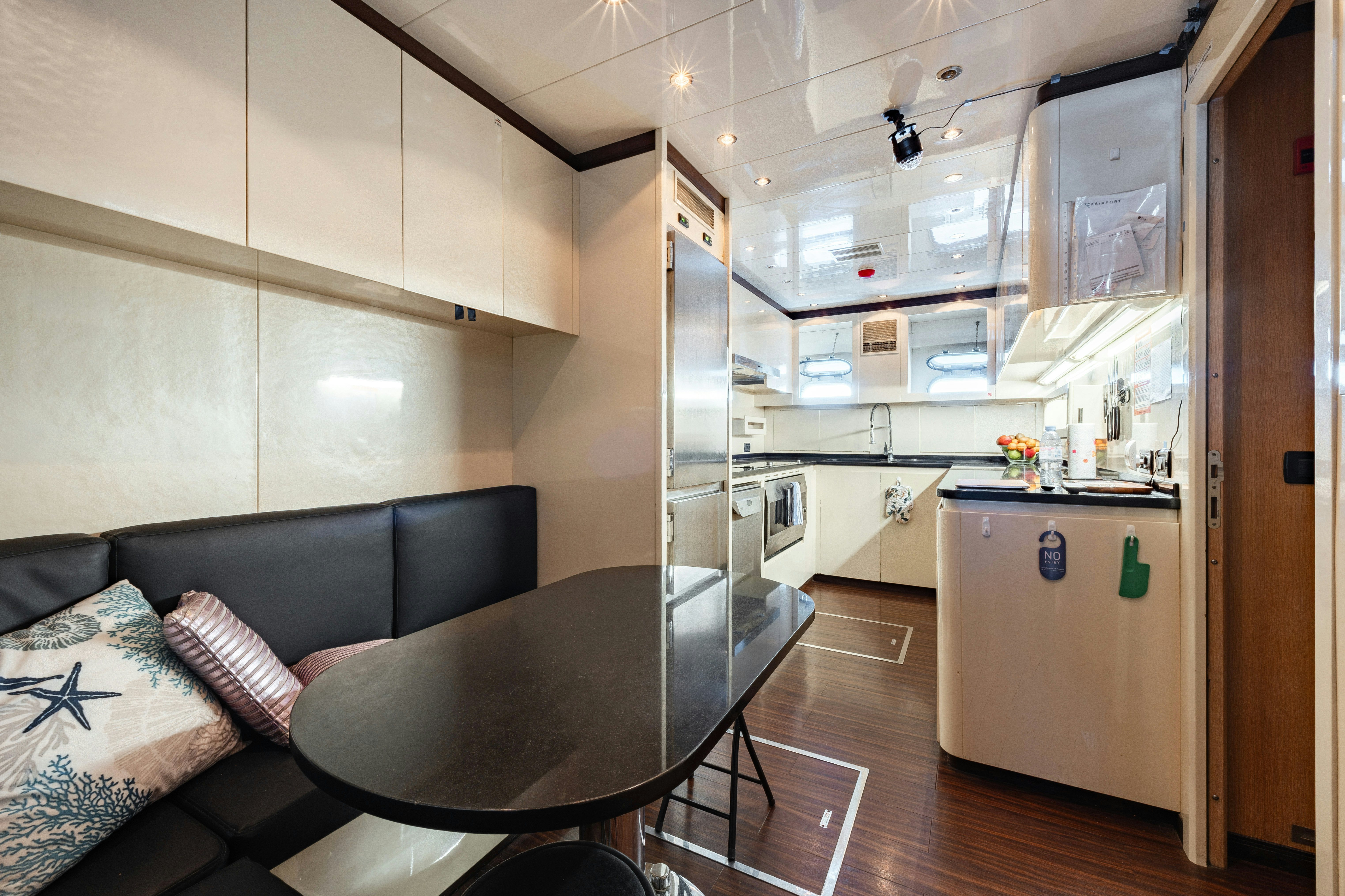 a kitchen with a couch and a table aboard BLUE AZUR Yacht for Sale