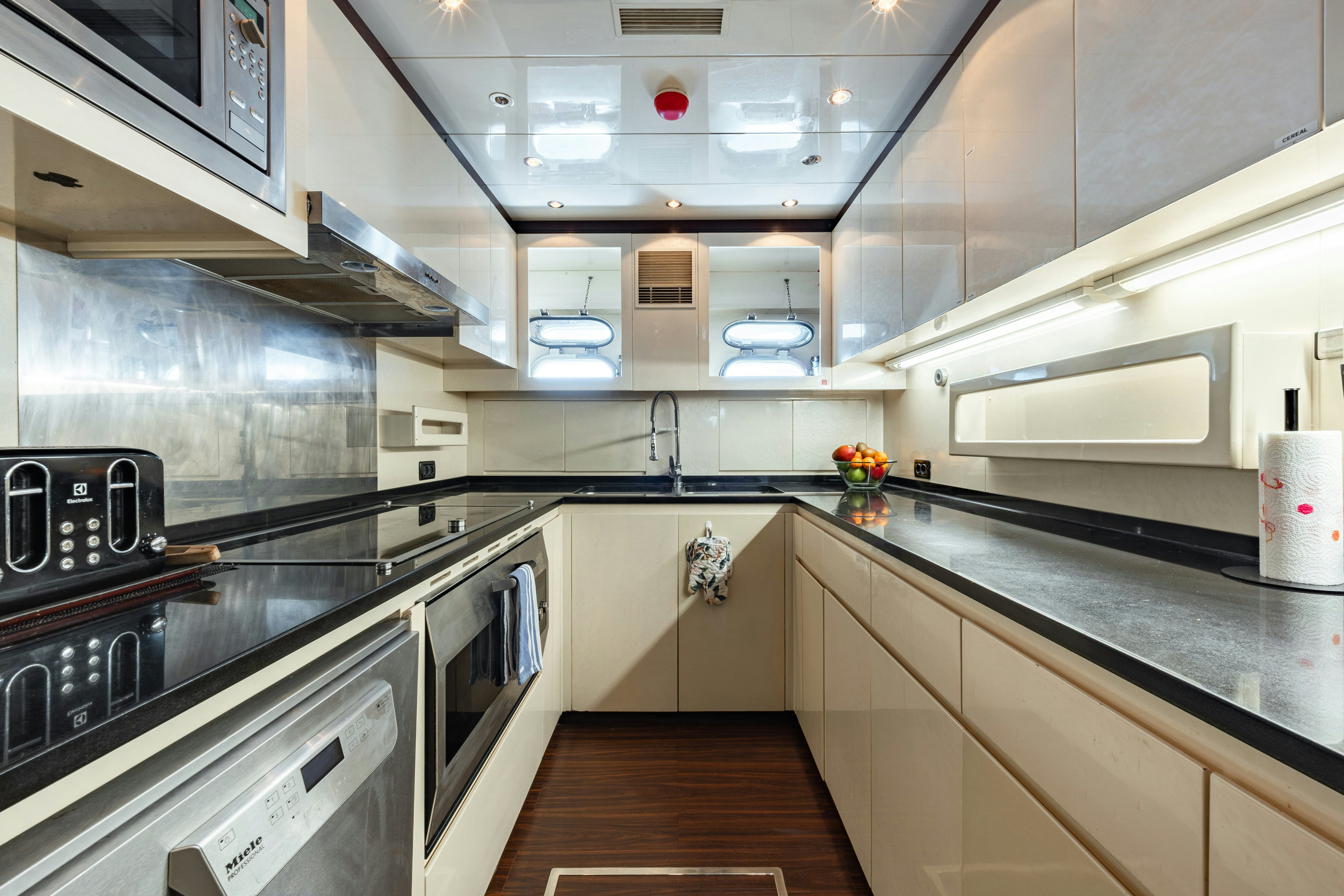 a kitchen with stainless steel appliances aboard BLUE AZUR Yacht for Sale
