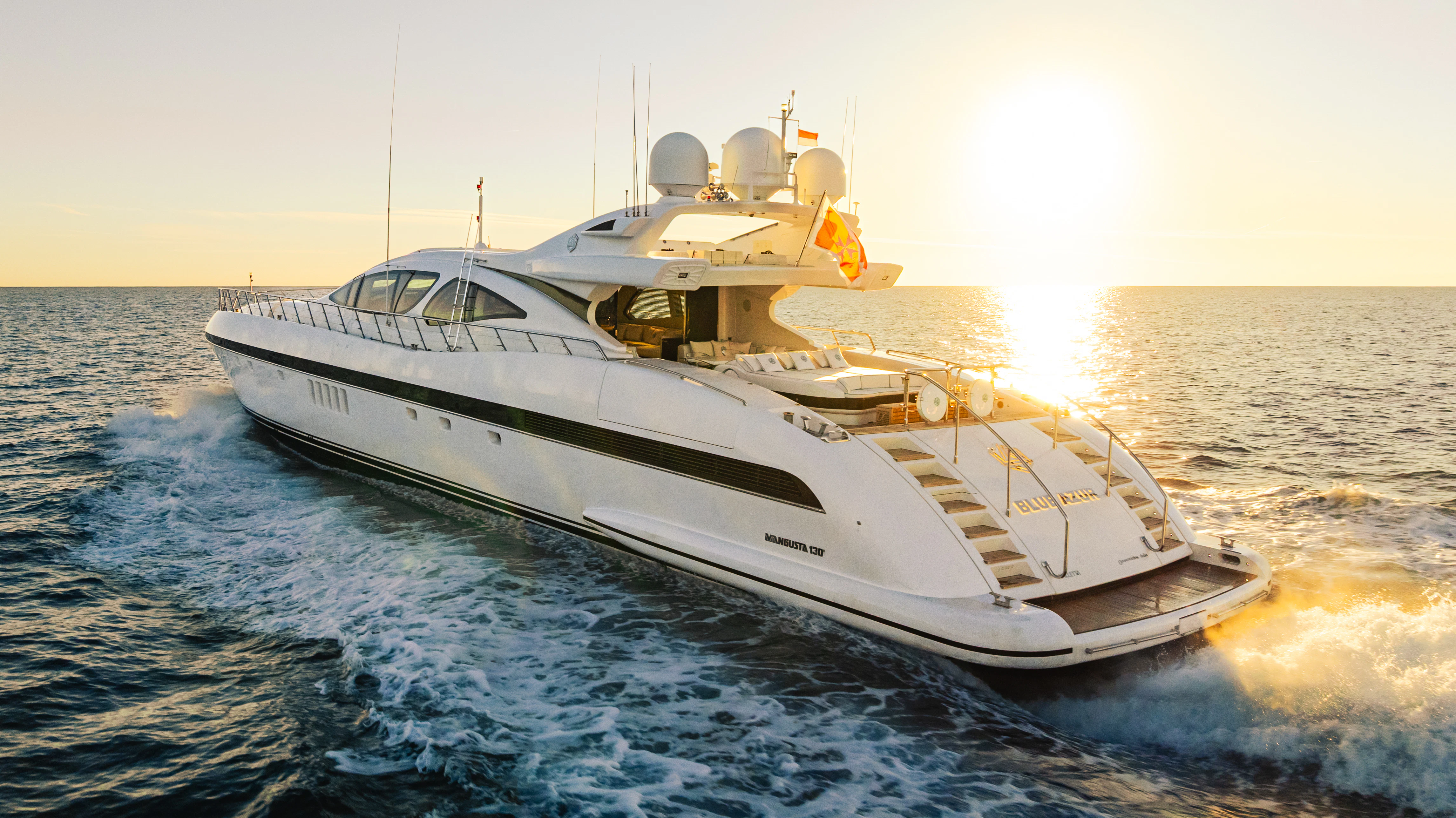 a large white boat on the water aboard BLUE AZUR Yacht for Charter