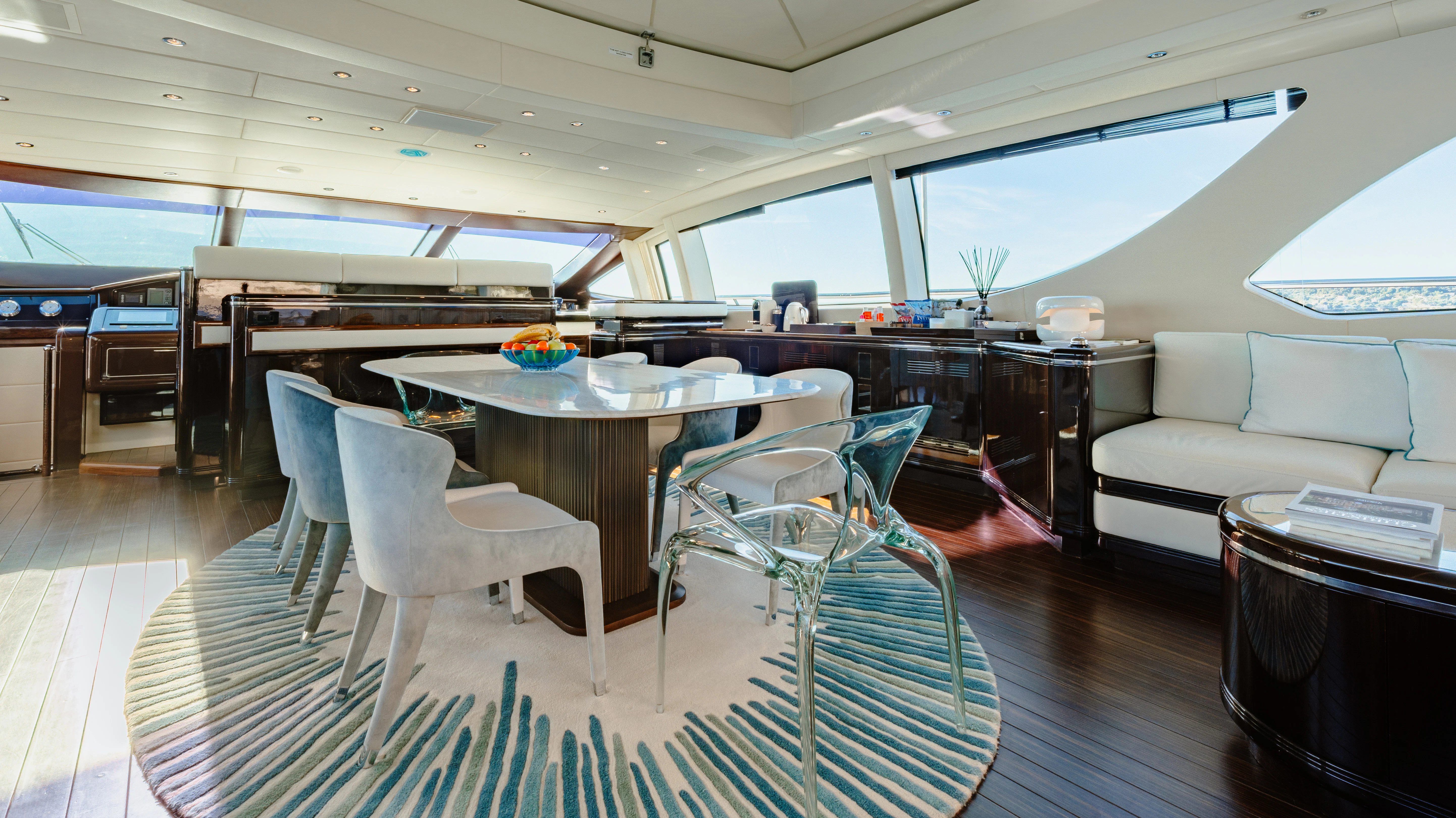 a room with a table and chairs aboard BLUE AZUR Yacht for Charter