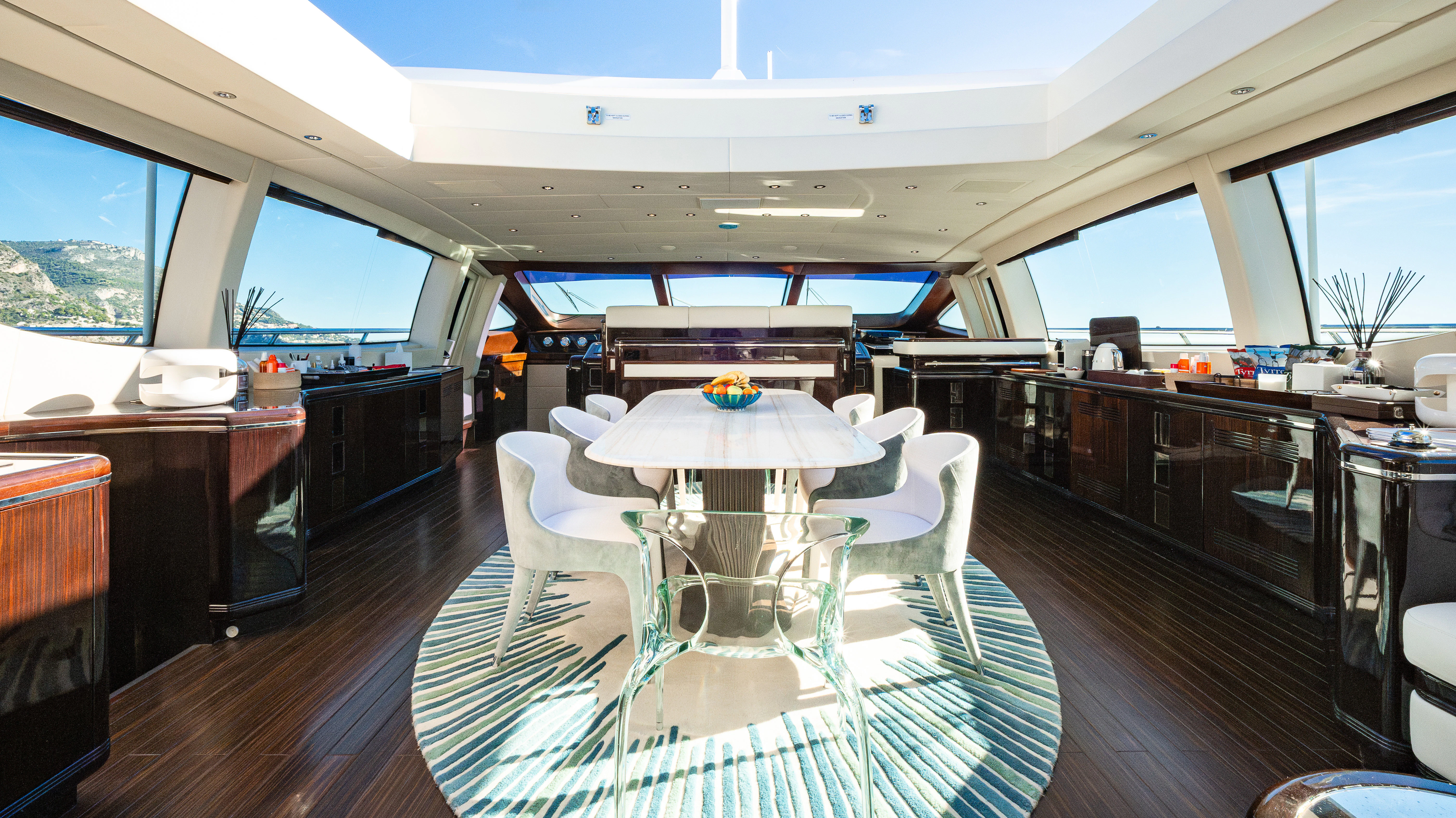 a room with a table and chairs aboard BLUE AZUR Yacht for Charter