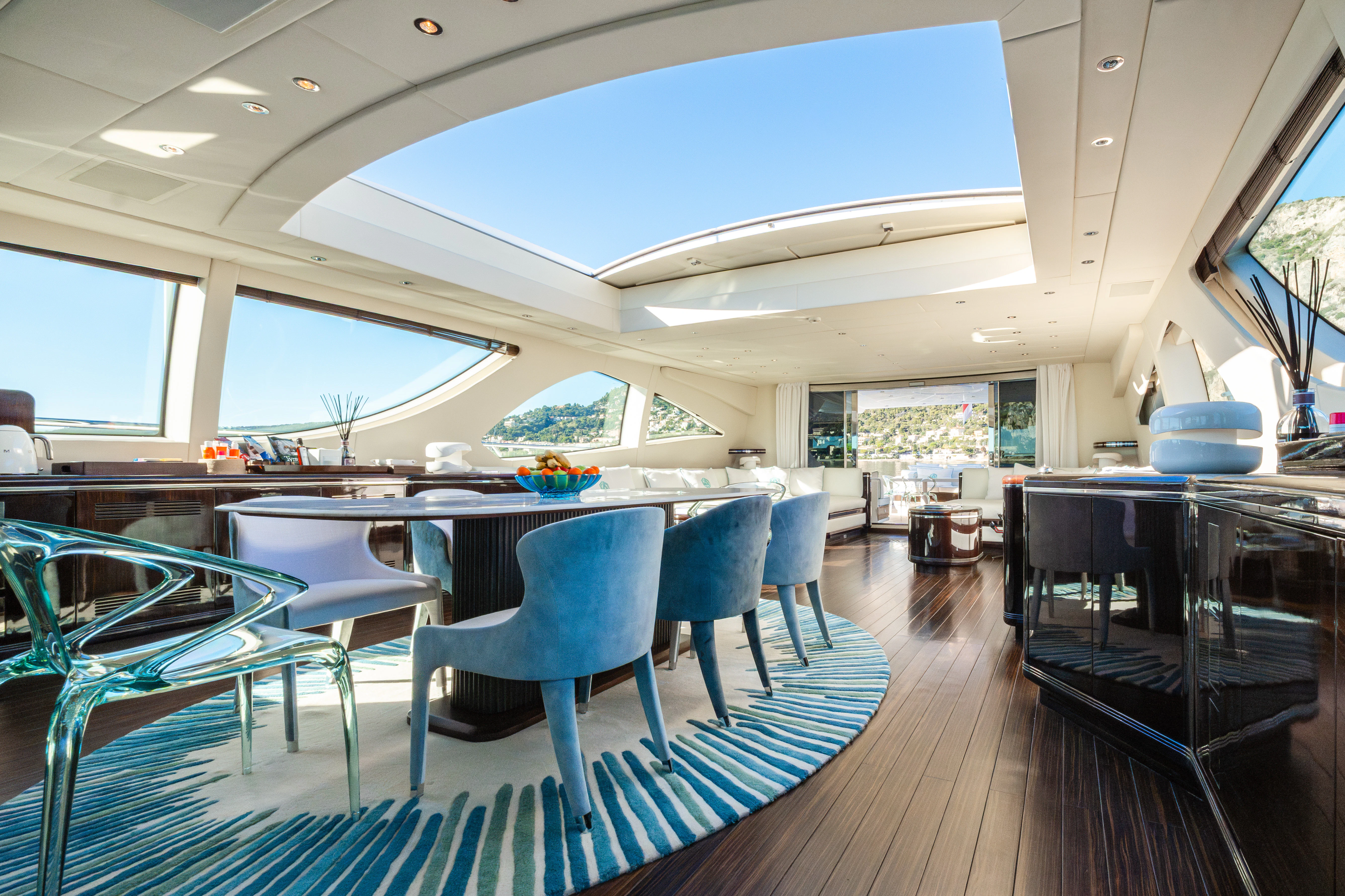 a room with a table and chairs aboard BLUE AZUR Yacht for Charter