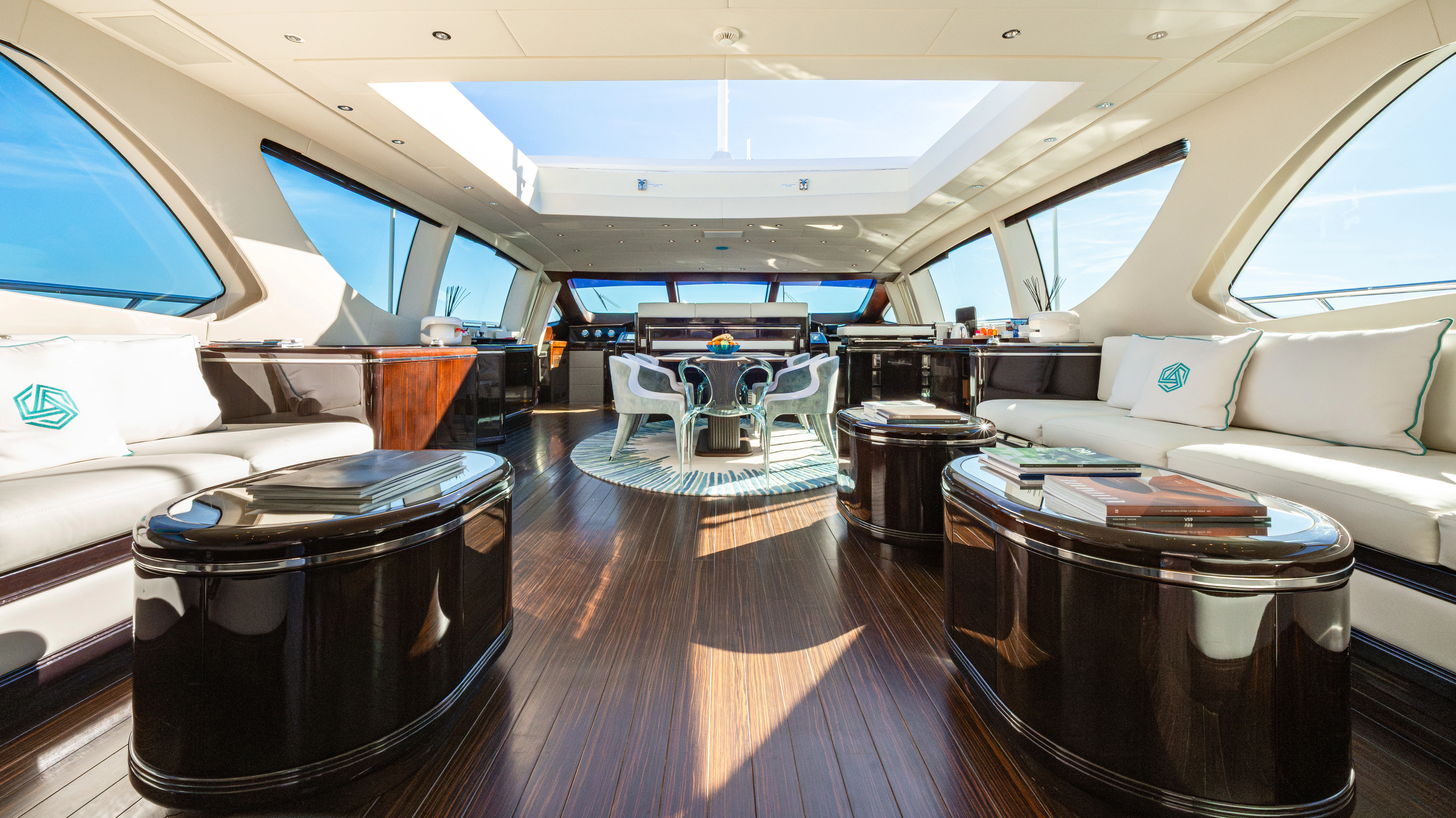a room with a couch and a table and chairs aboard BLUE AZUR Yacht for Charter