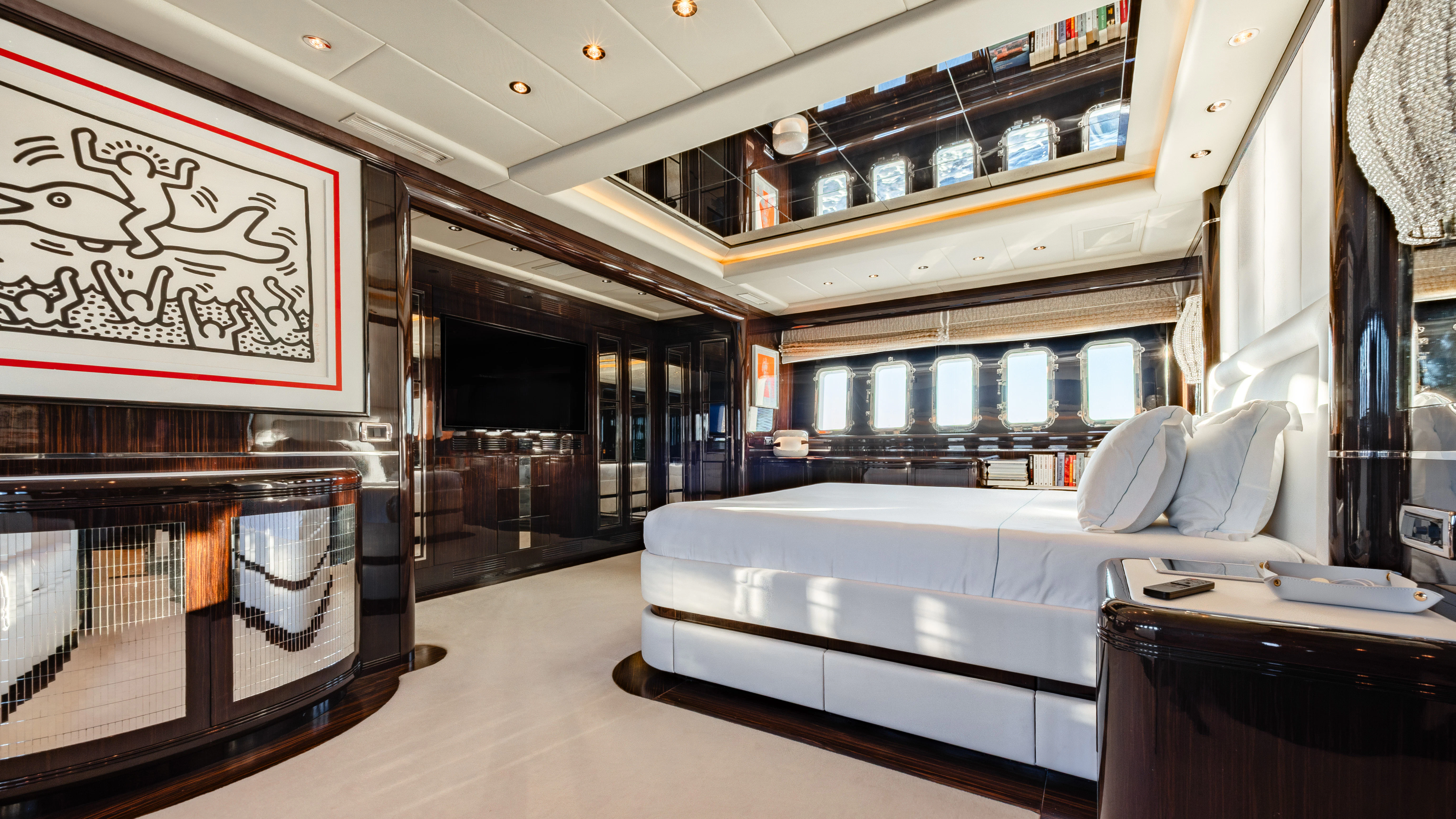 a room with a couch and a bed aboard BLUE AZUR Yacht for Charter