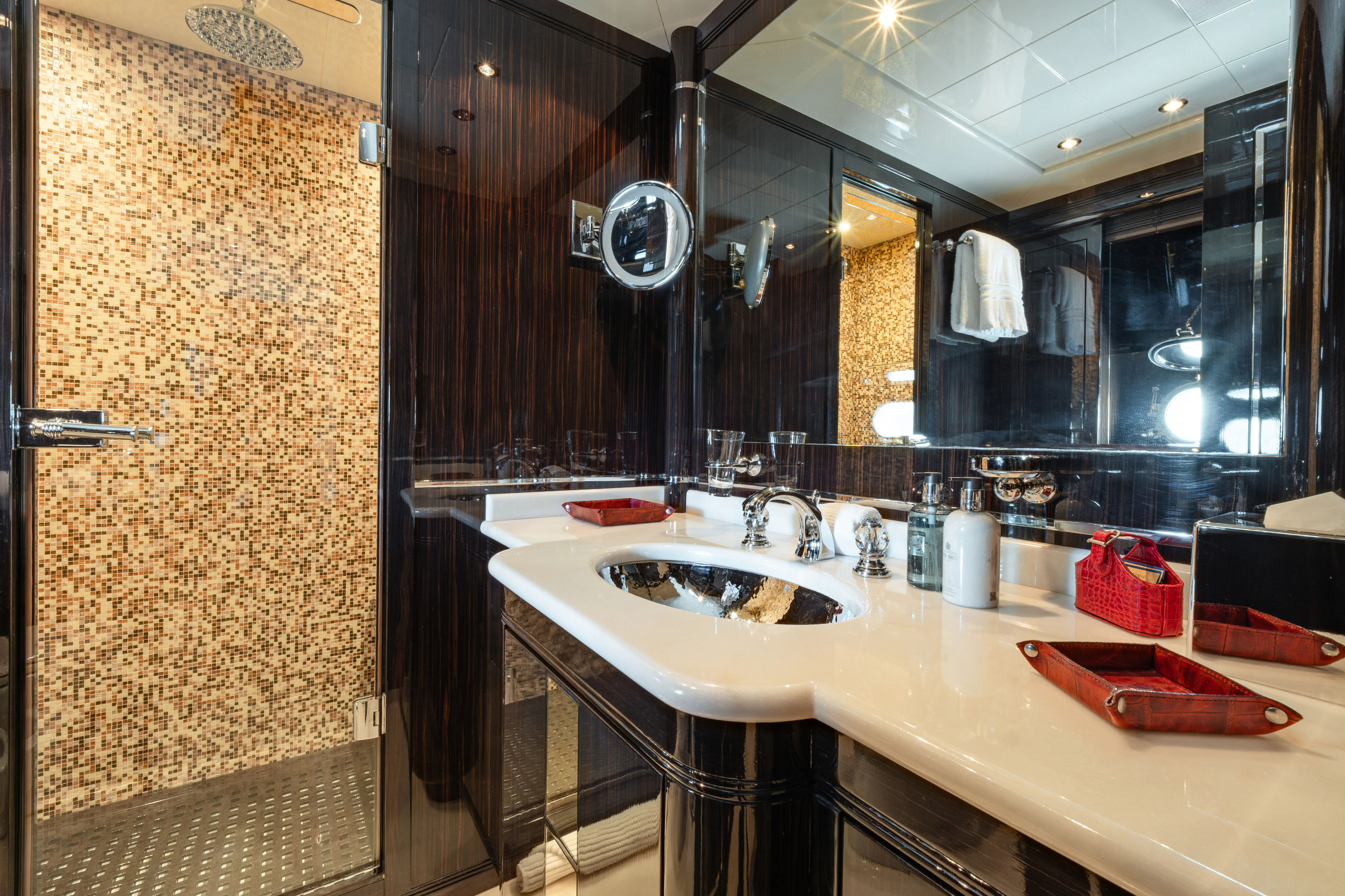 a bathroom with a large mirror aboard BLUE AZUR Yacht for Charter