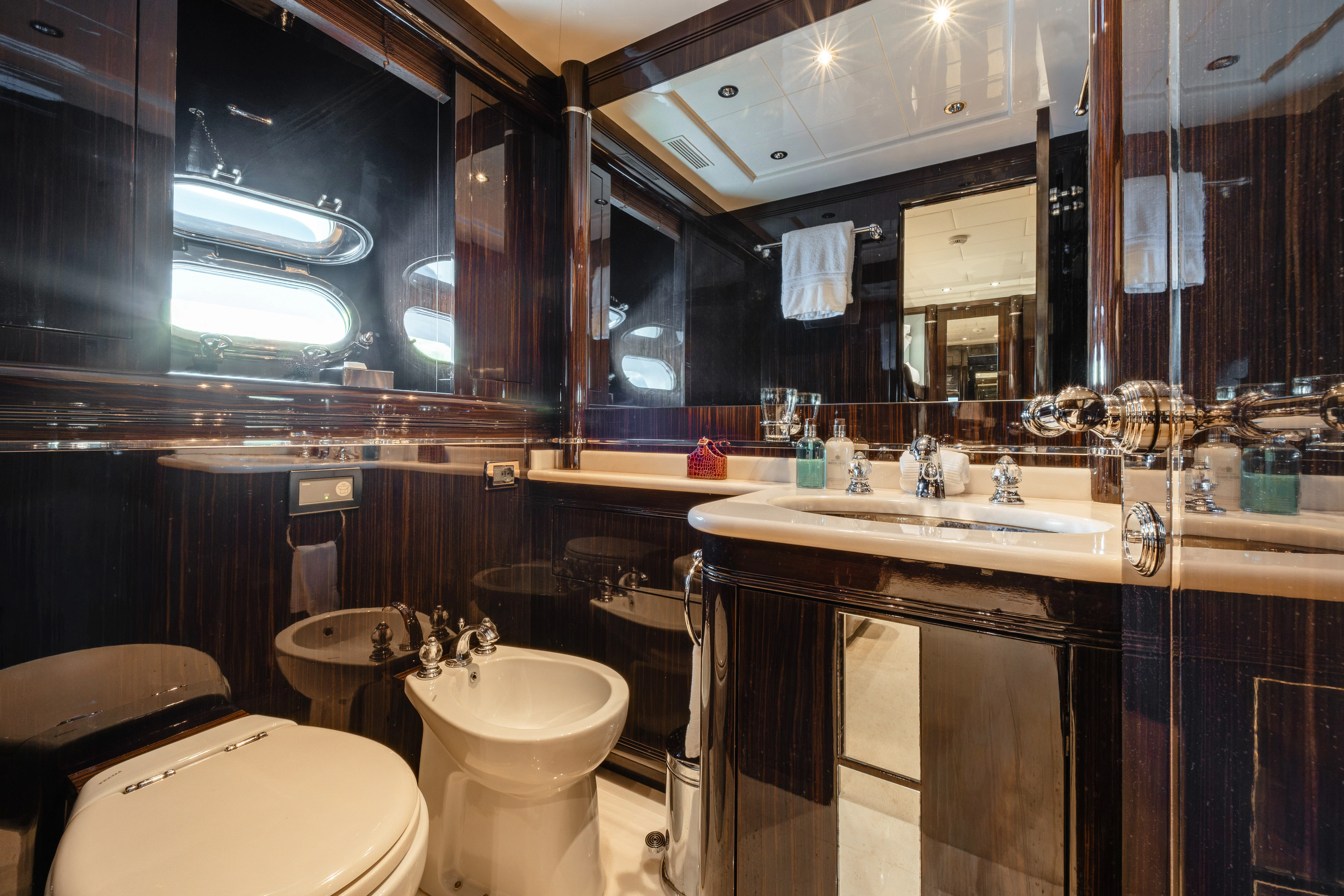 a bathroom with a large mirror aboard BLUE AZUR Yacht for Charter