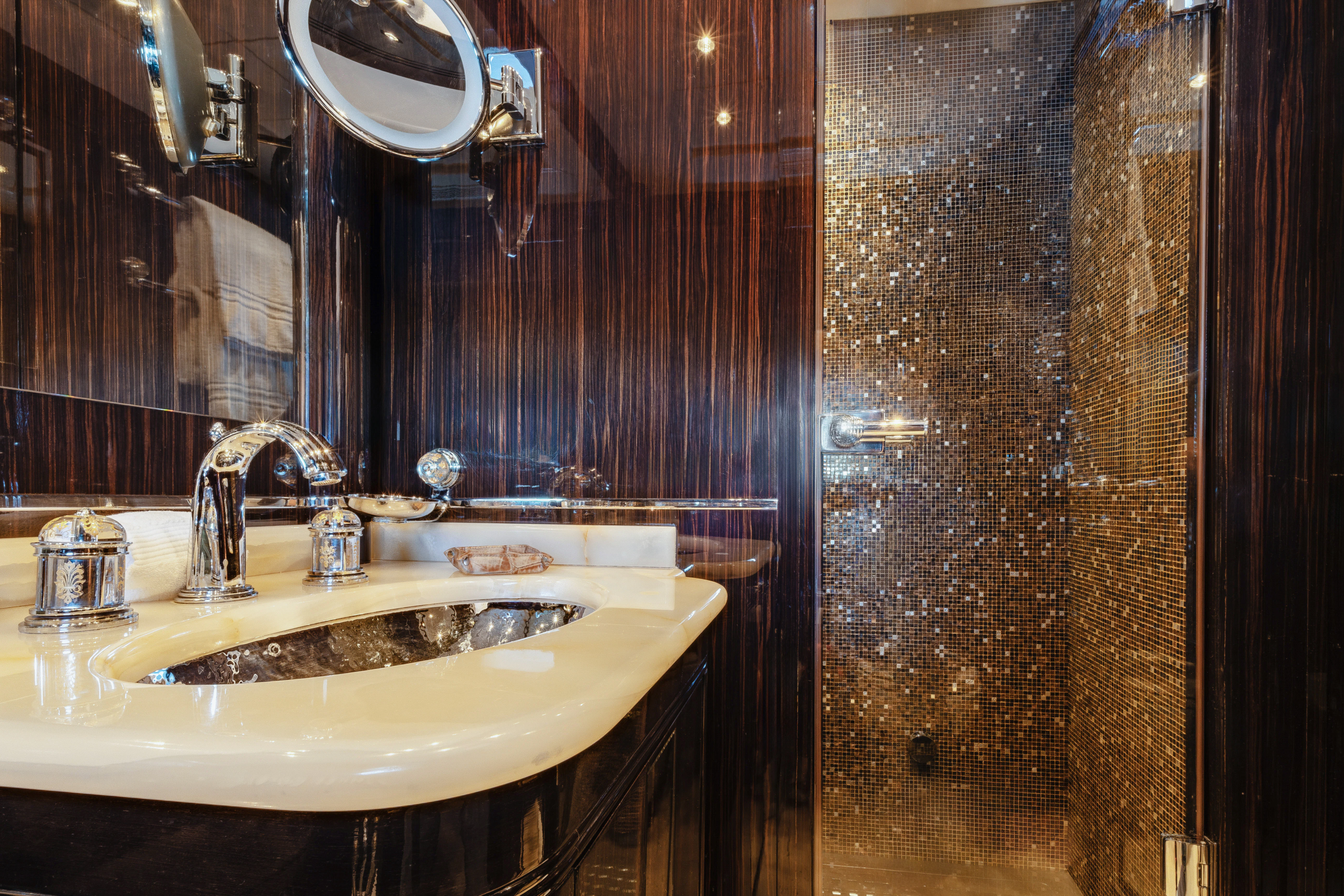 a bathroom with a sink and a mirror aboard BLUE AZUR Yacht for Charter