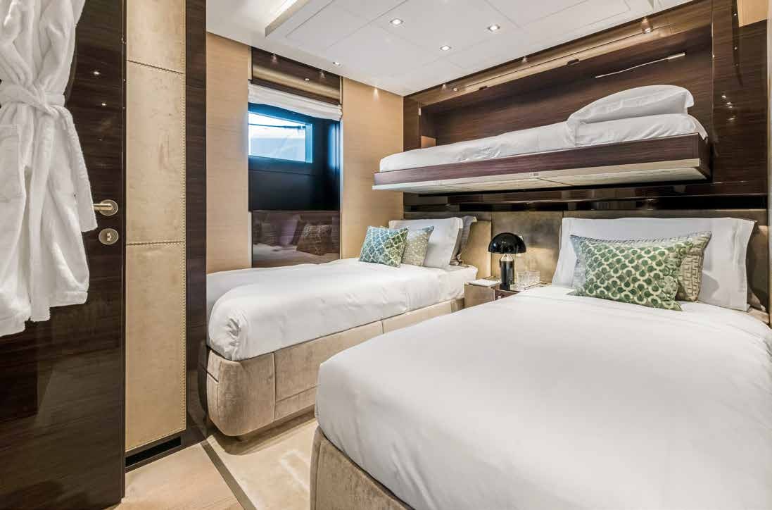 a couple of beds in a hotel room aboard NURI Yacht for Charter