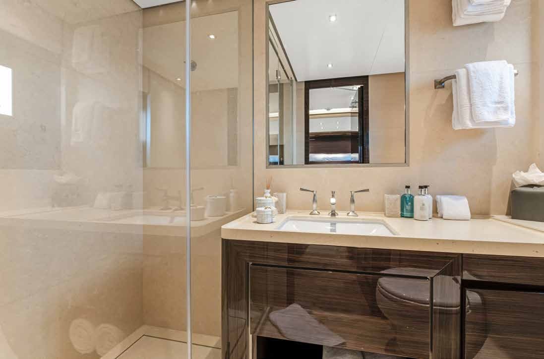 a bathroom with a glass shower aboard NURI Yacht for Charter