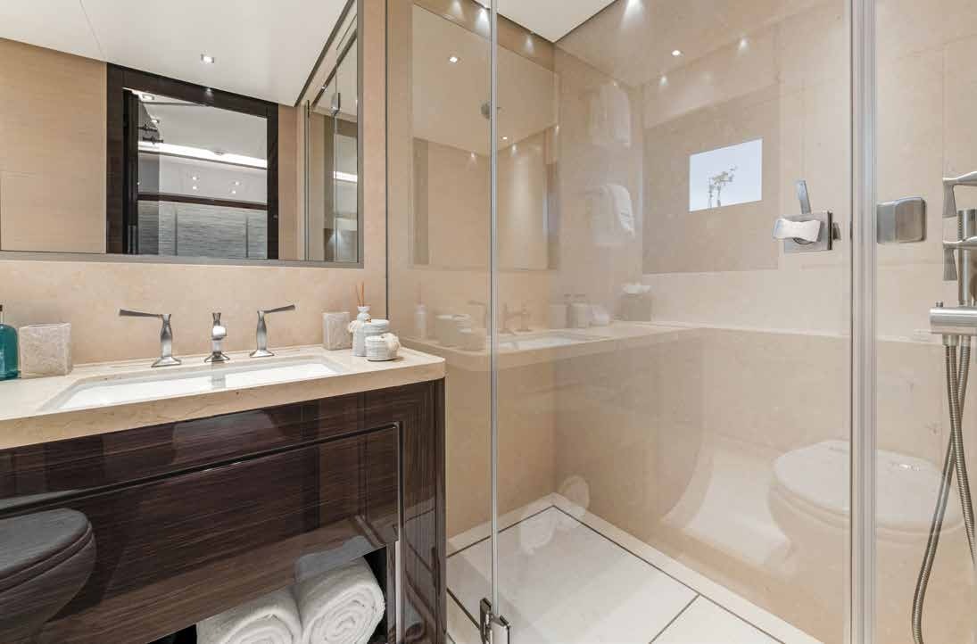 a bathroom with a glass shower aboard NURI Yacht for Charter