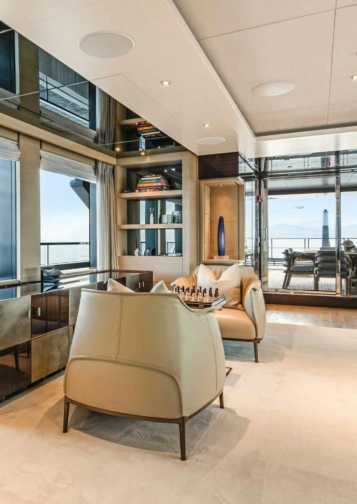 a living room with a couch and a table aboard NURI Yacht for Charter