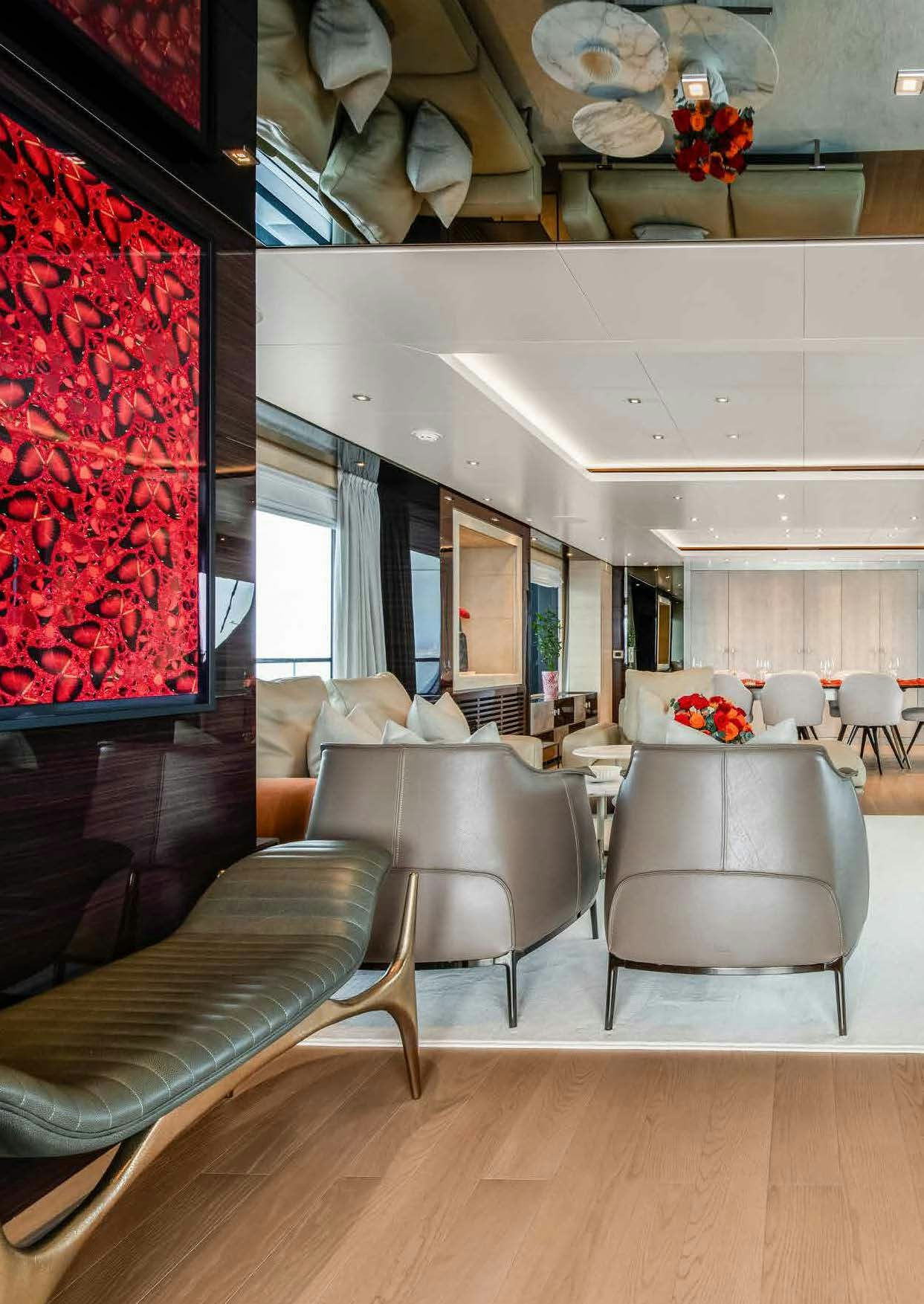 a room with a couch and chairs aboard NURI Yacht for Charter