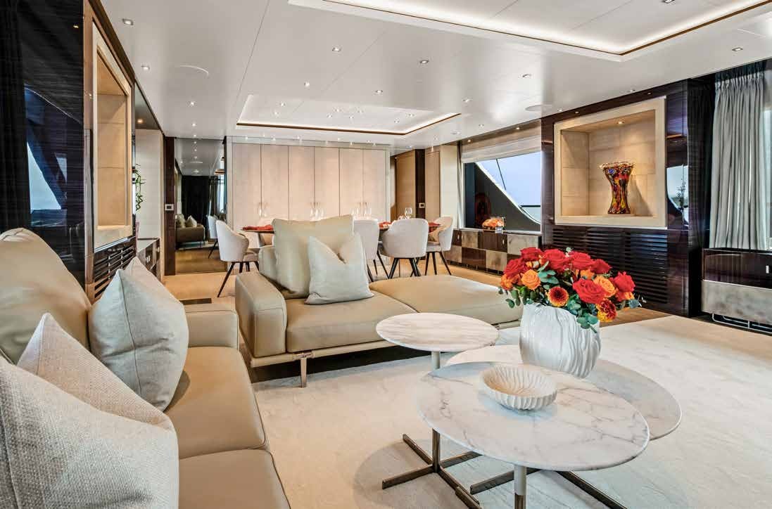 a living room with a table and chairs aboard NURI Yacht for Charter
