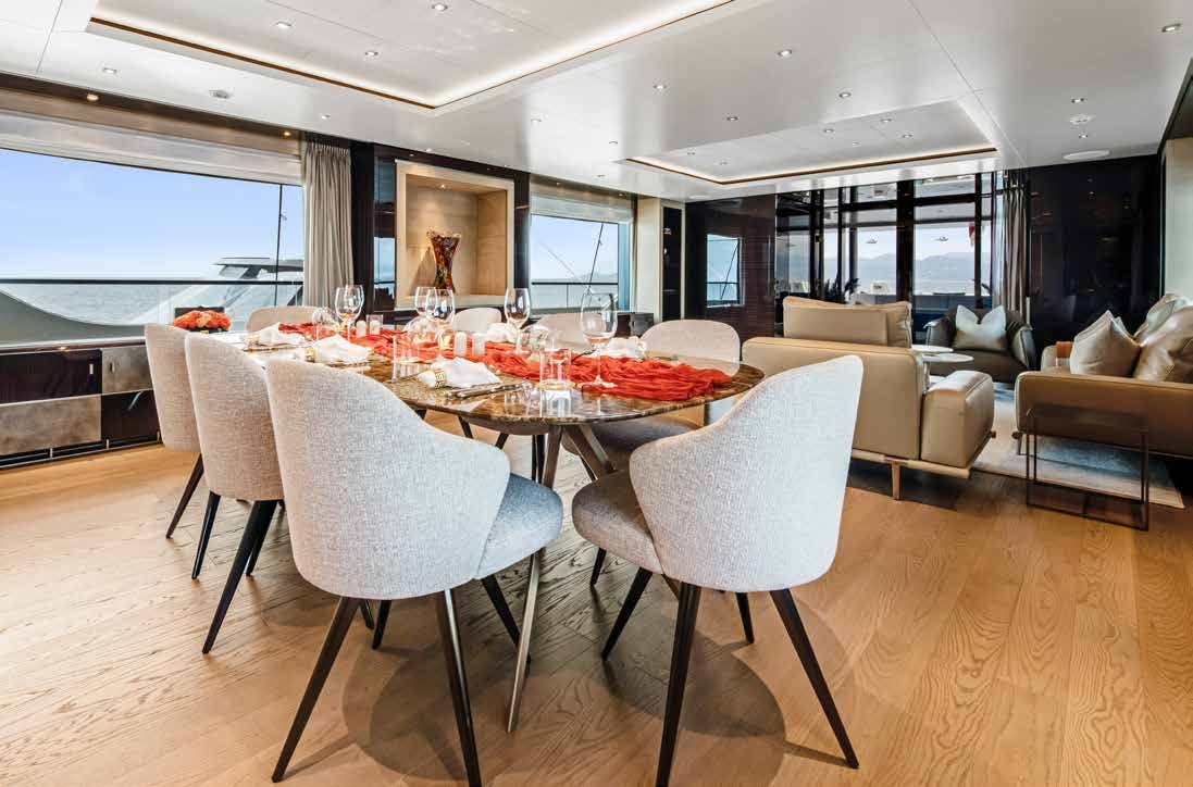 a large dining room with a table and chairs aboard NURI Yacht for Charter