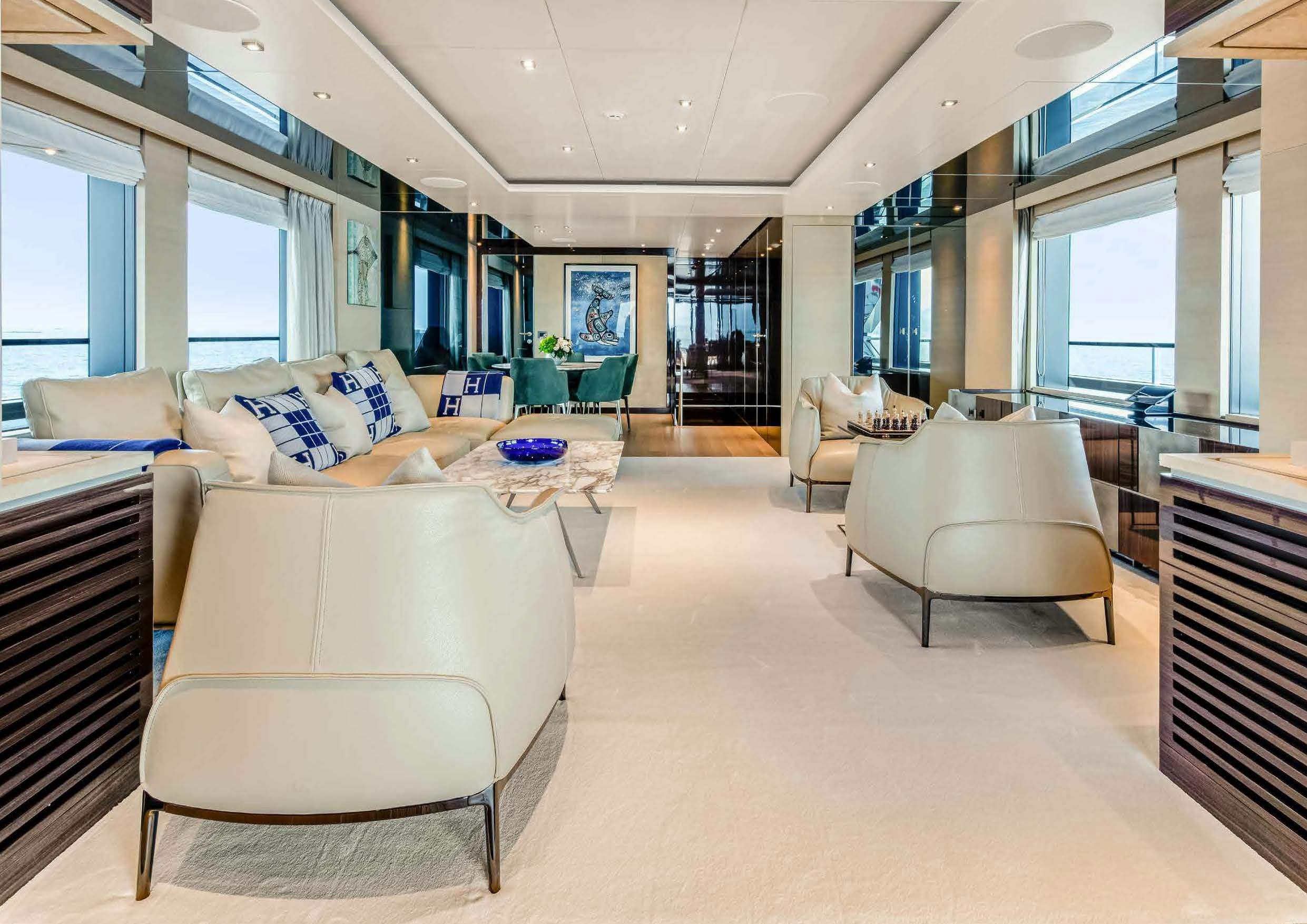 a large living room with a large window aboard NURI Yacht for Charter