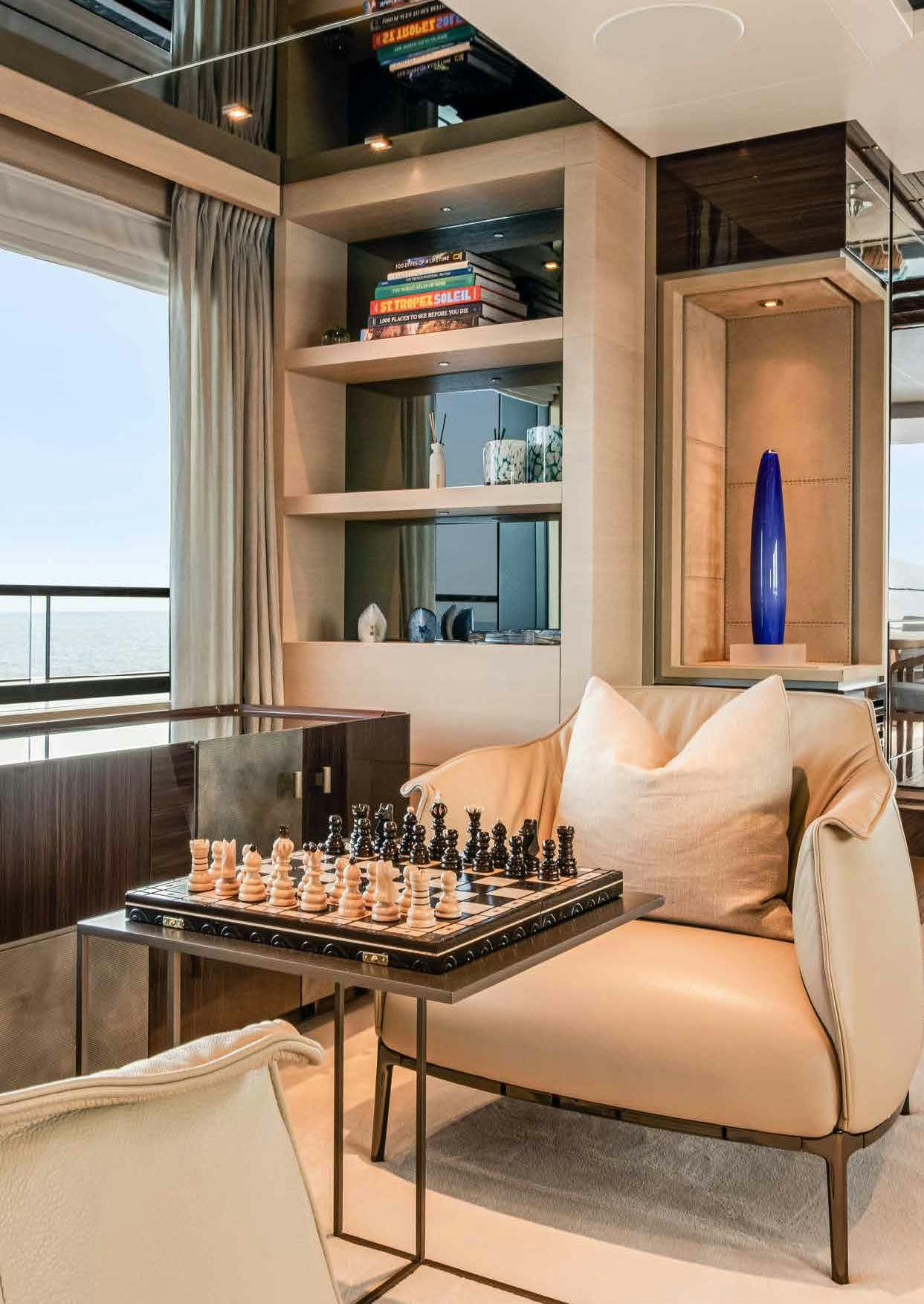 a room with a table and a couch aboard NURI Yacht for Charter