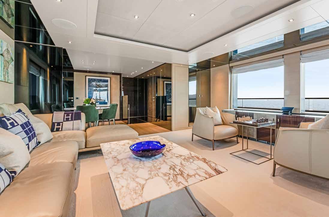 a living room with a large window aboard NURI Yacht for Charter