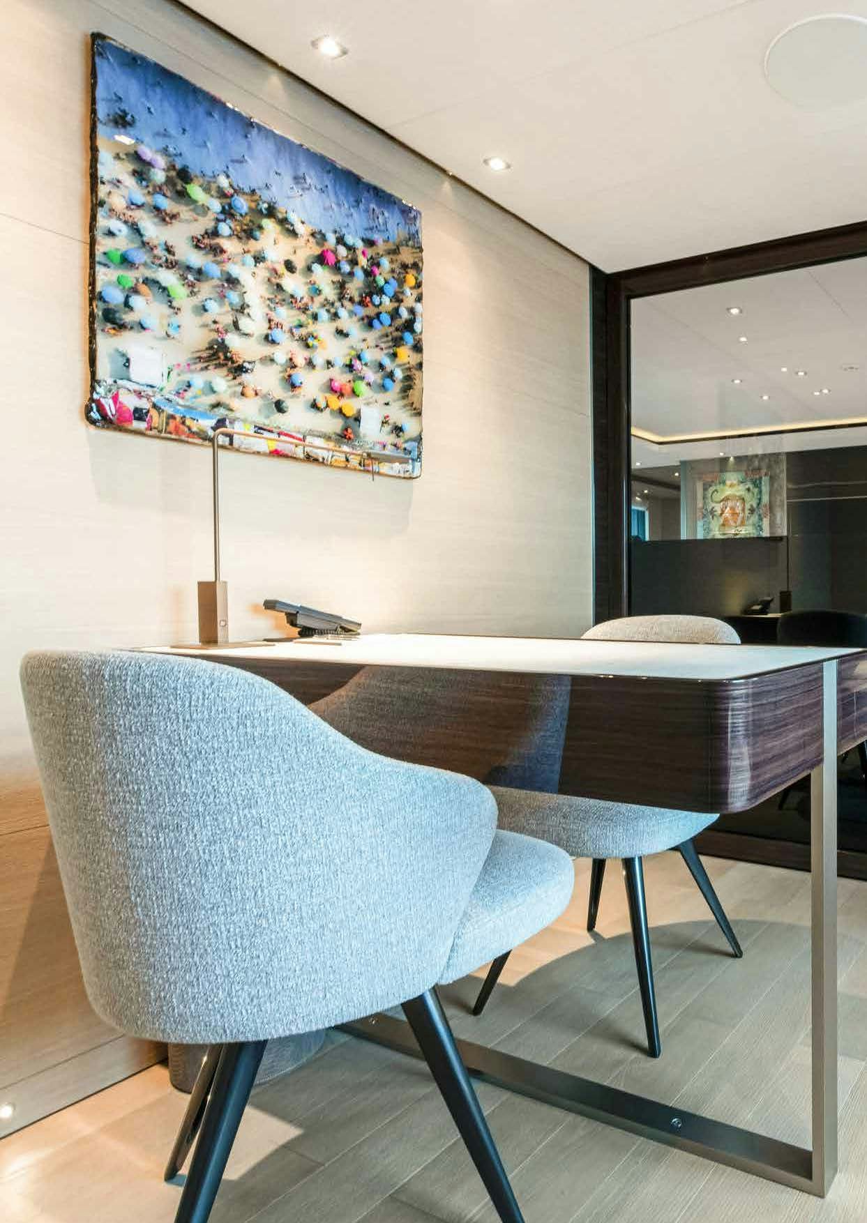 a room with a table and chairs aboard NURI Yacht for Charter