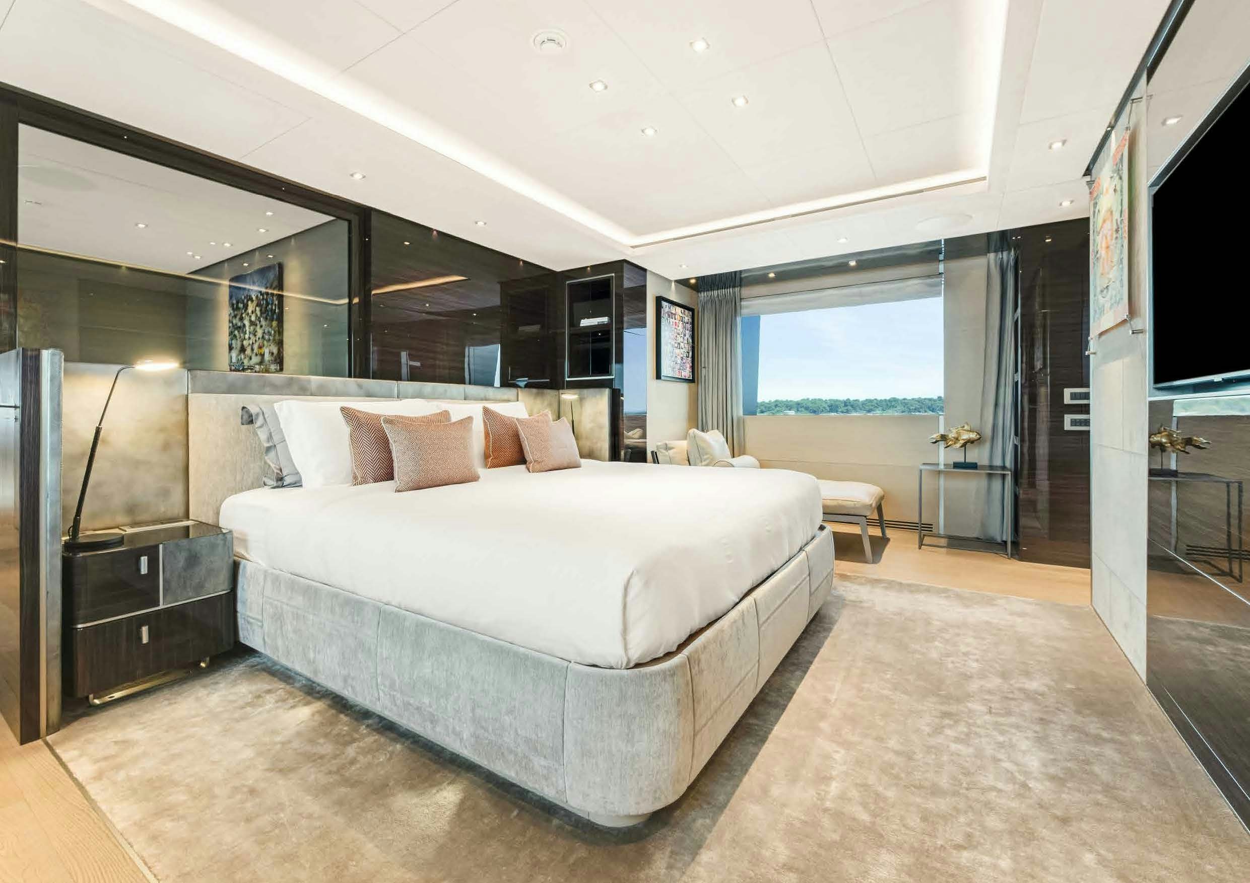 a large bedroom with a large bed aboard NURI Yacht for Charter