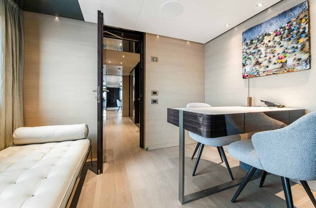 a room with a table and chairs aboard NURI Yacht for Charter
