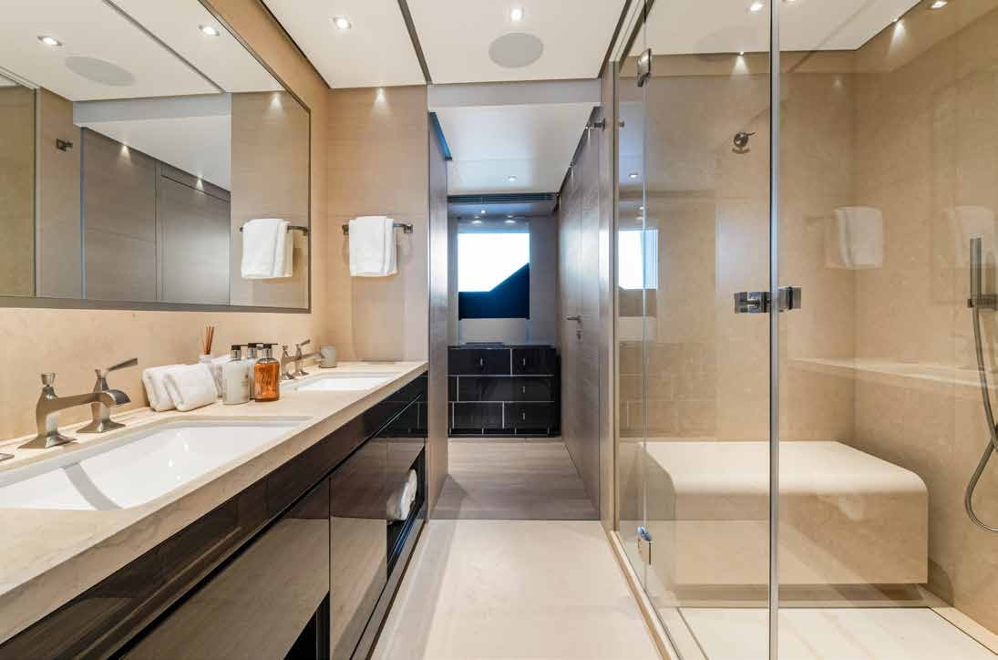 a bathroom with a glass shower aboard NURI Yacht for Charter