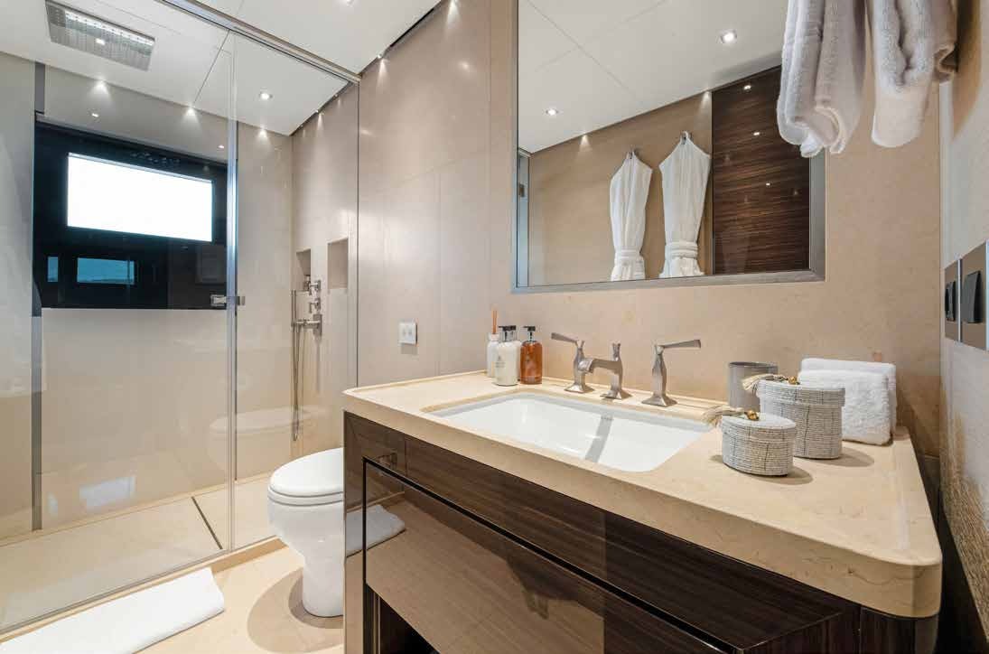 a bathroom with a large mirror aboard NURI Yacht for Charter