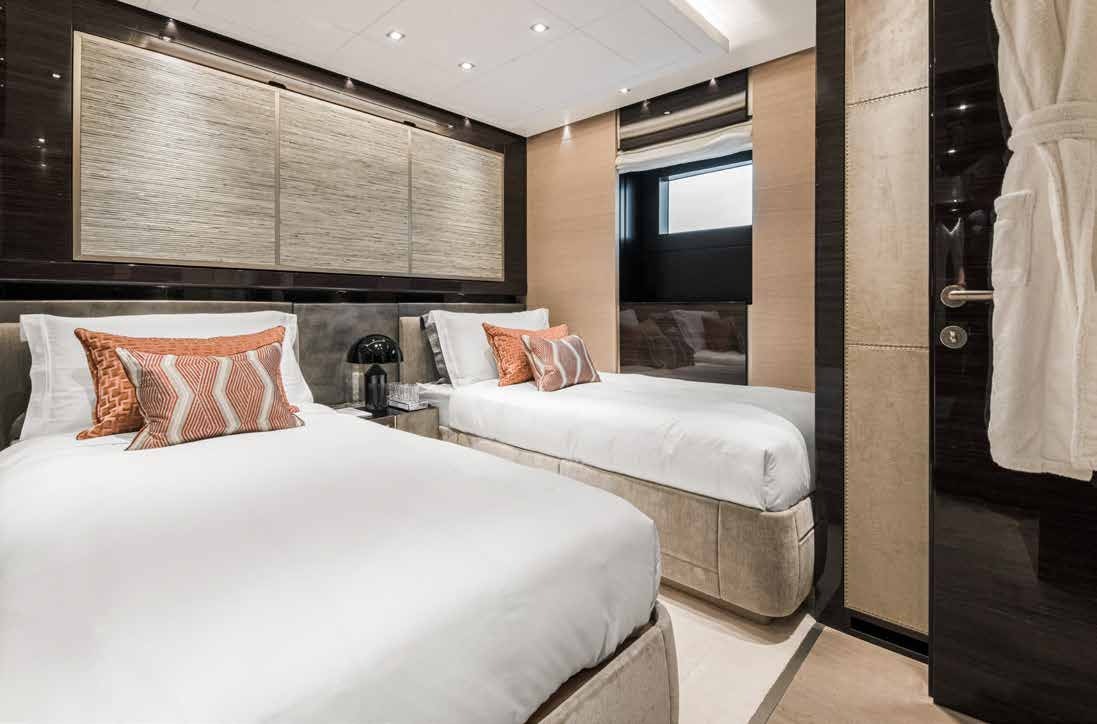 a couple of beds in a hotel room aboard NURI Yacht for Charter