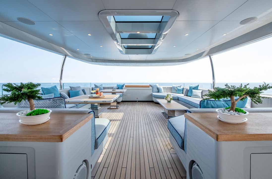 a room with a table and chairs aboard NURI Yacht for Charter