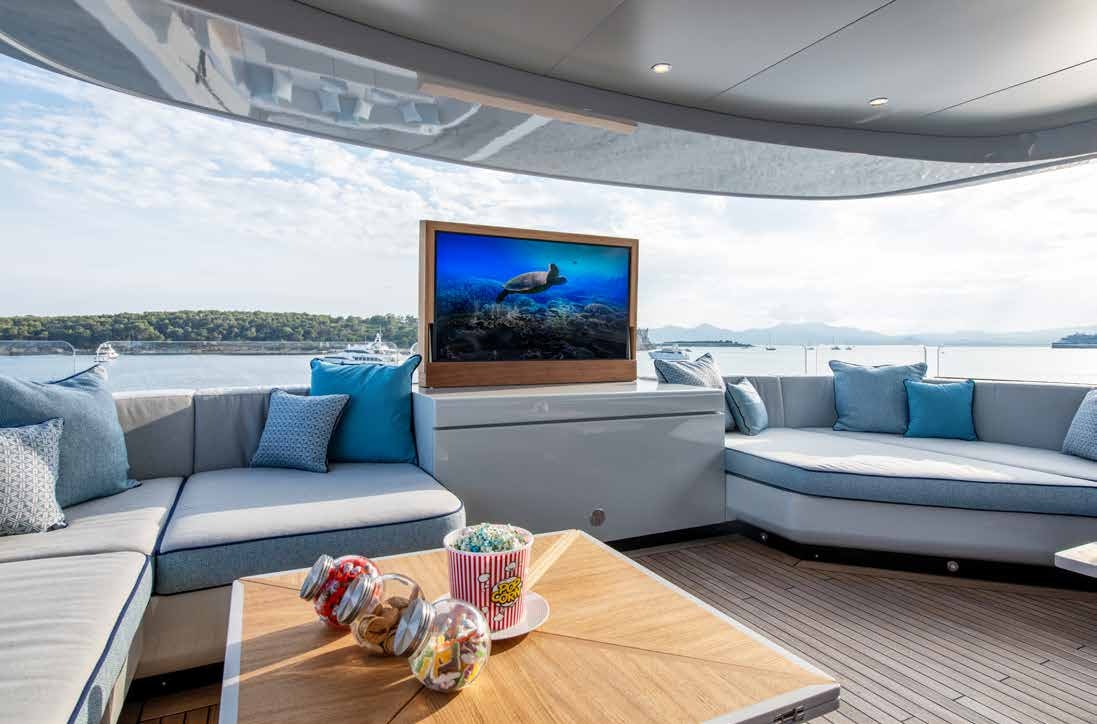 a living room with a large screen aboard NURI Yacht for Charter