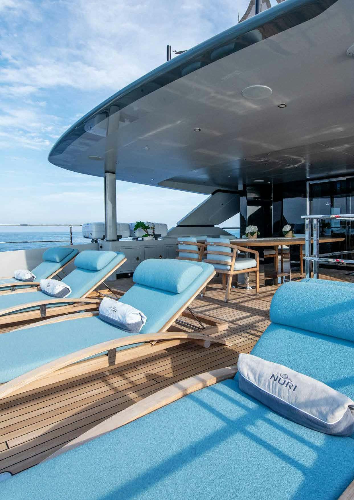 a large modern building with a pool aboard NURI Yacht for Charter