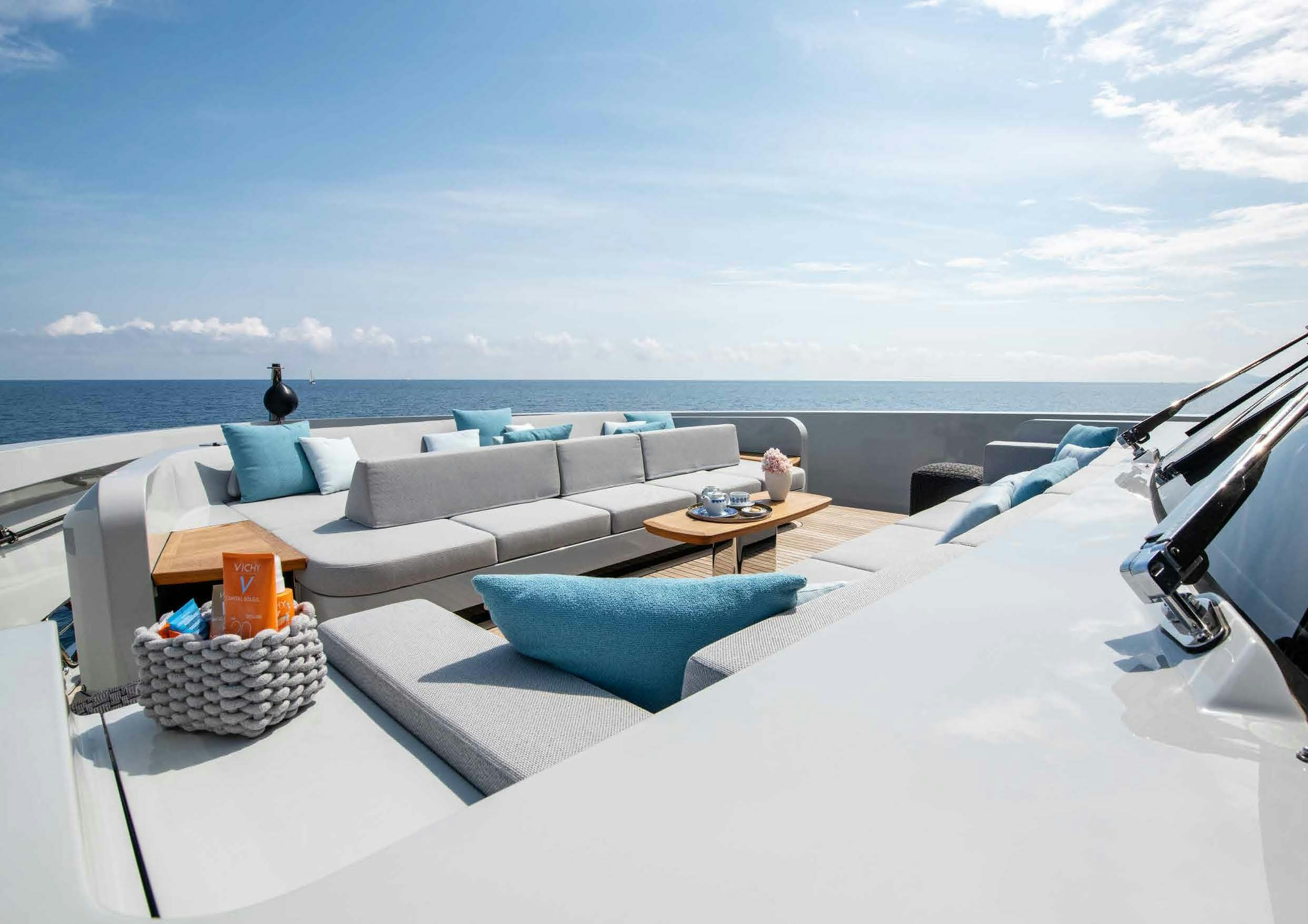 a modern living room with a large body of water aboard NURI Yacht for Charter